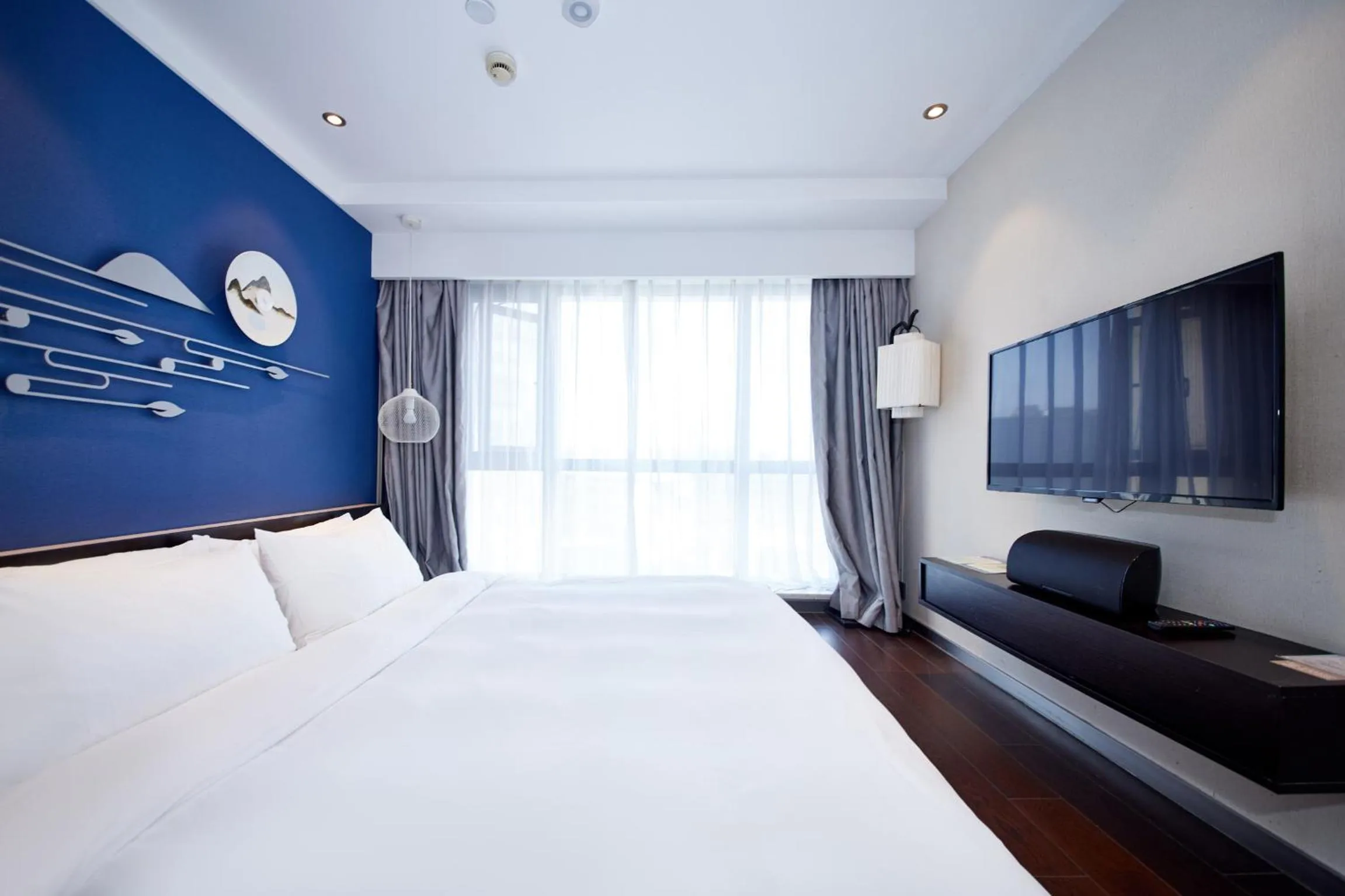 Bedroom, Bed in Orange Hotel Shanghai Hongkou Football Stadium Branch