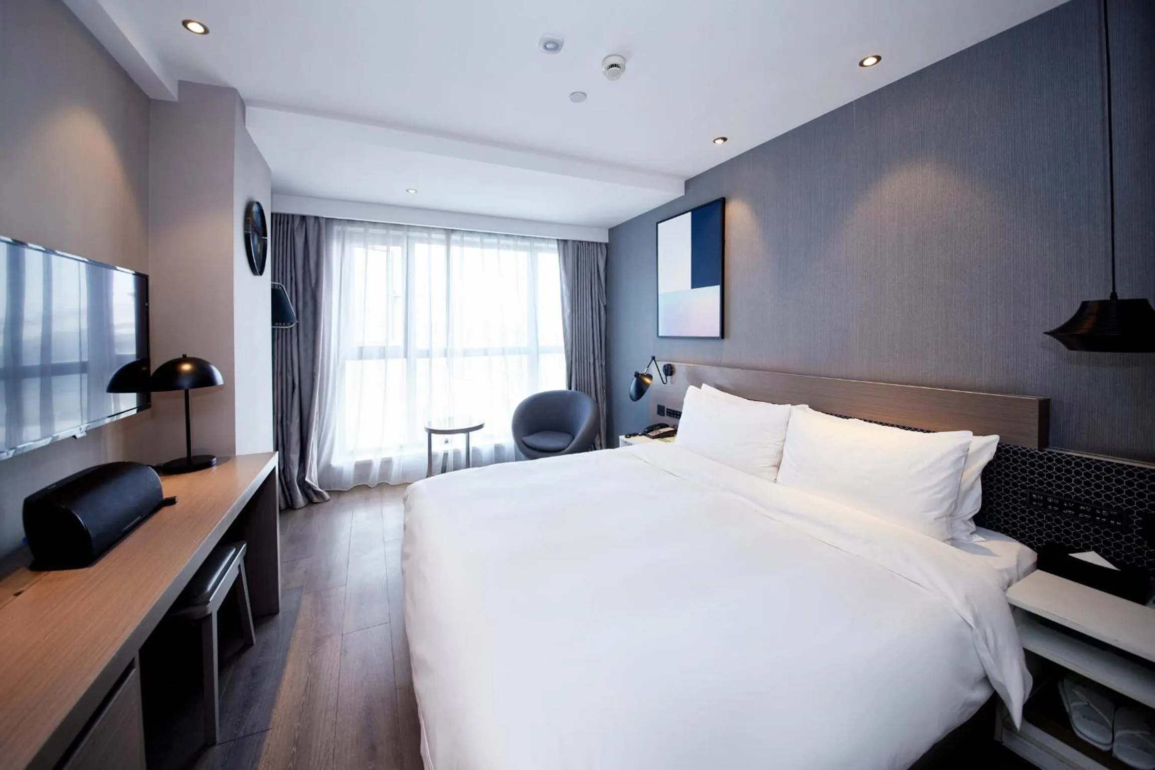 Bedroom, Bed in Orange Hotel Shanghai Hongkou Football Stadium Branch
