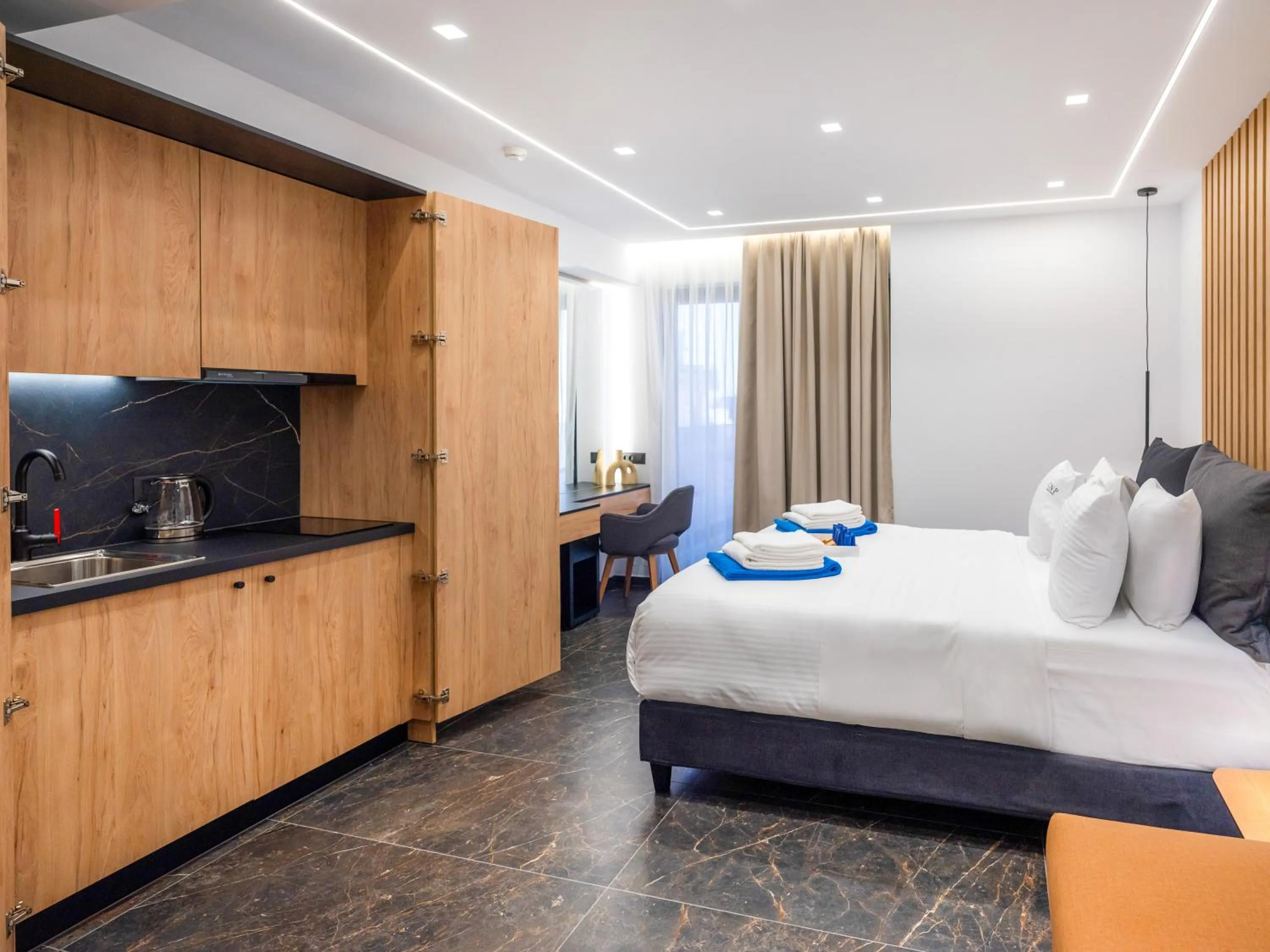 Bed in Captain Napoleon Paterakis CNP Luxurious Suites