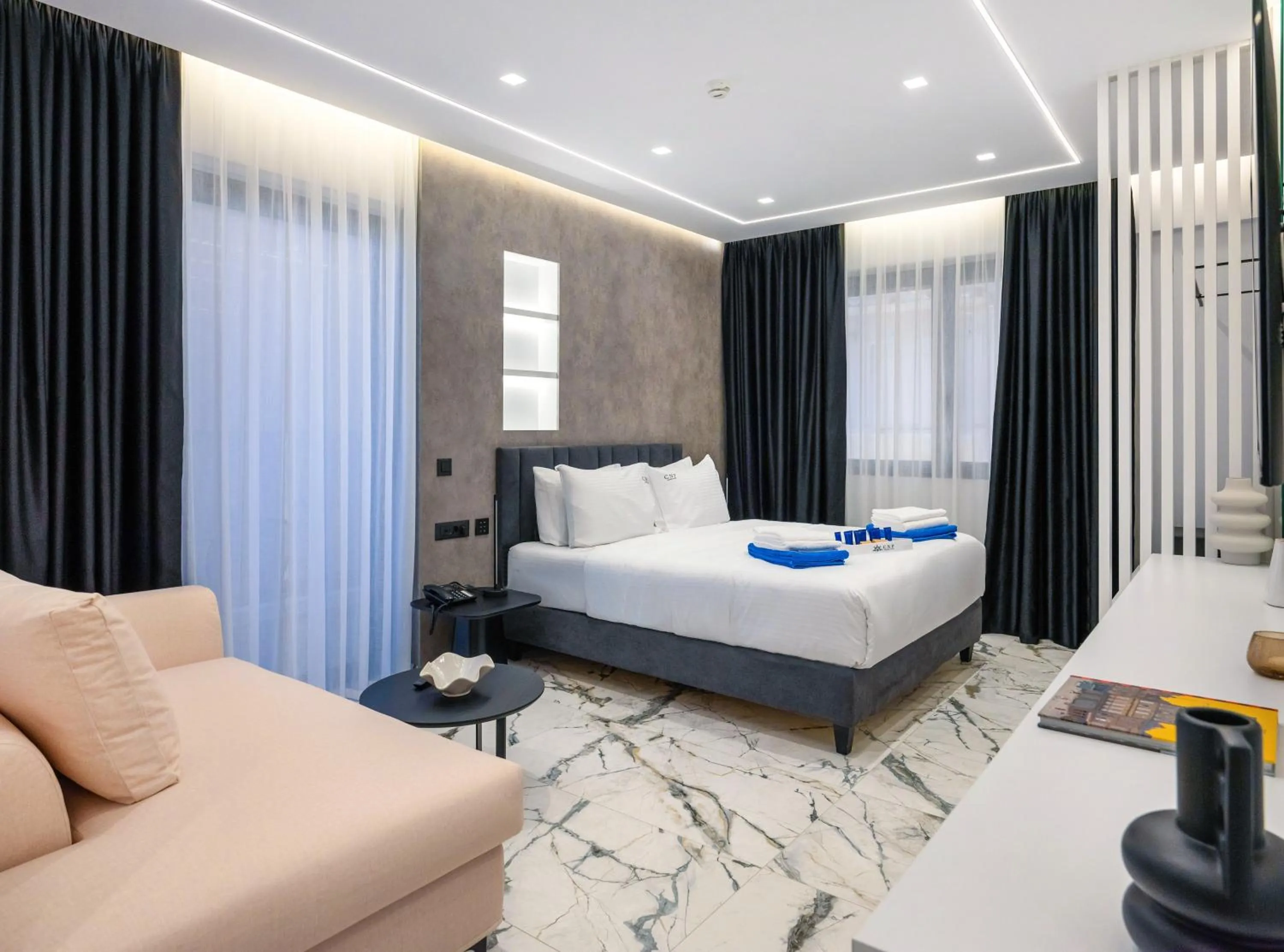 Bed in Captain Napoleon Paterakis CNP Luxurious Suites