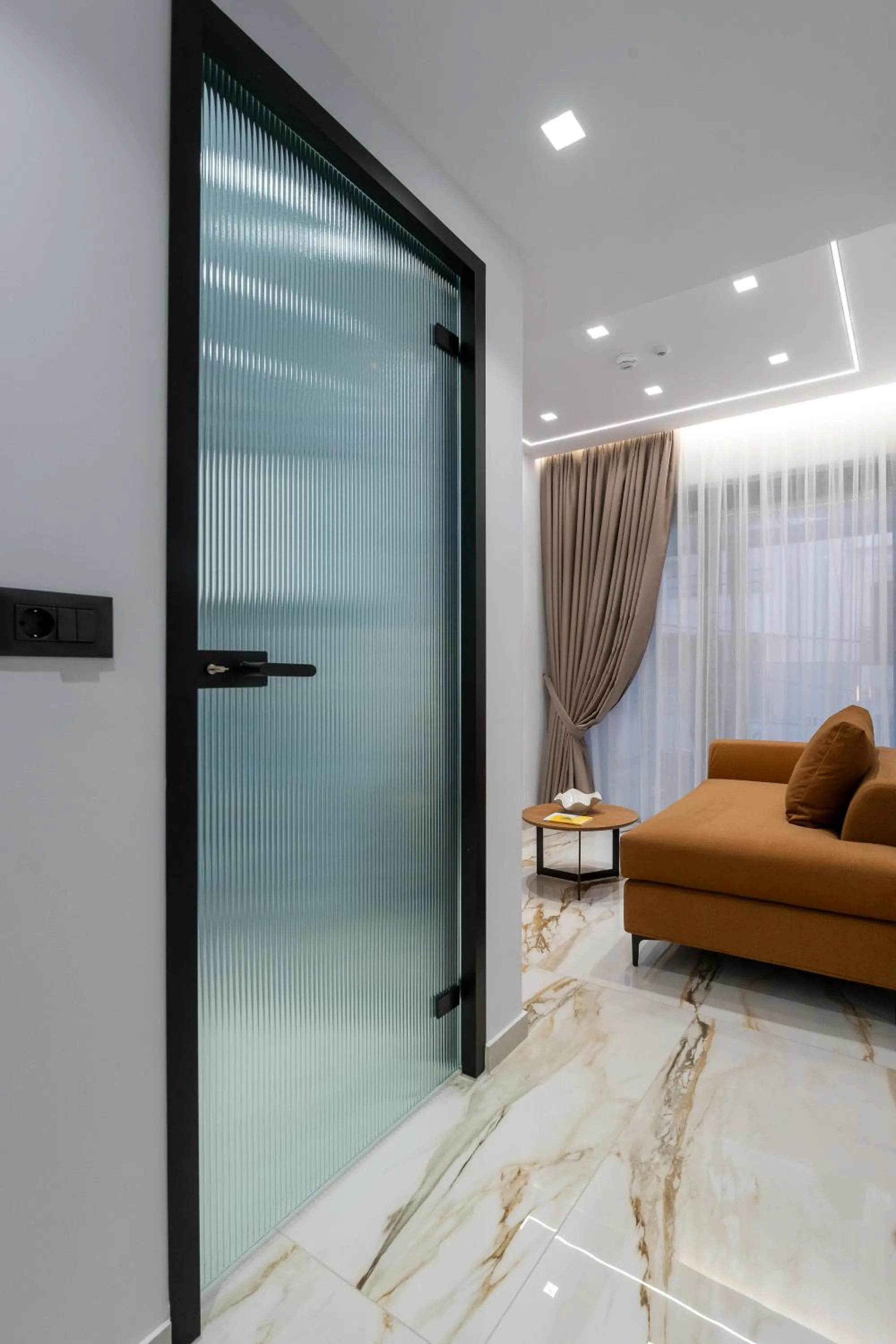 Seating area in Captain Napoleon Paterakis CNP Luxurious Suites