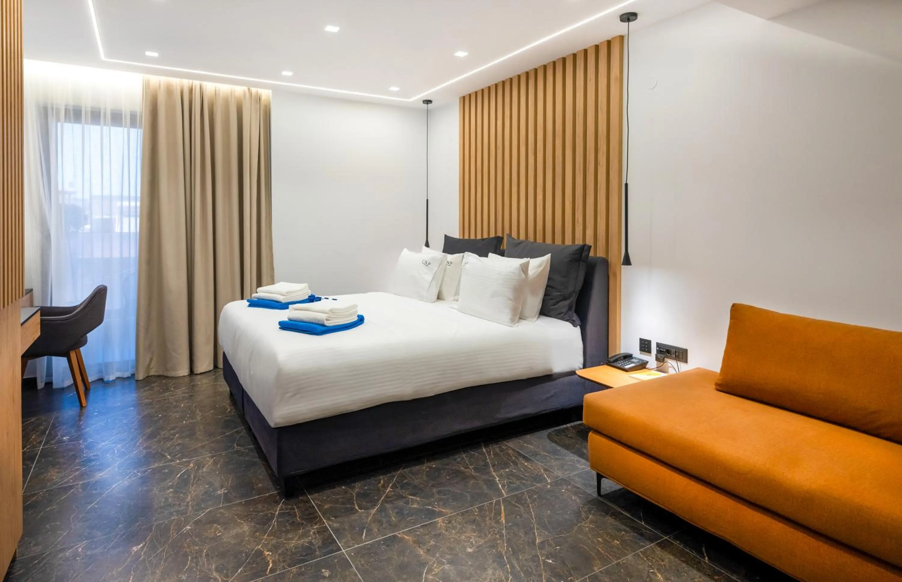 Bed in Captain Napoleon Paterakis CNP Luxurious Suites