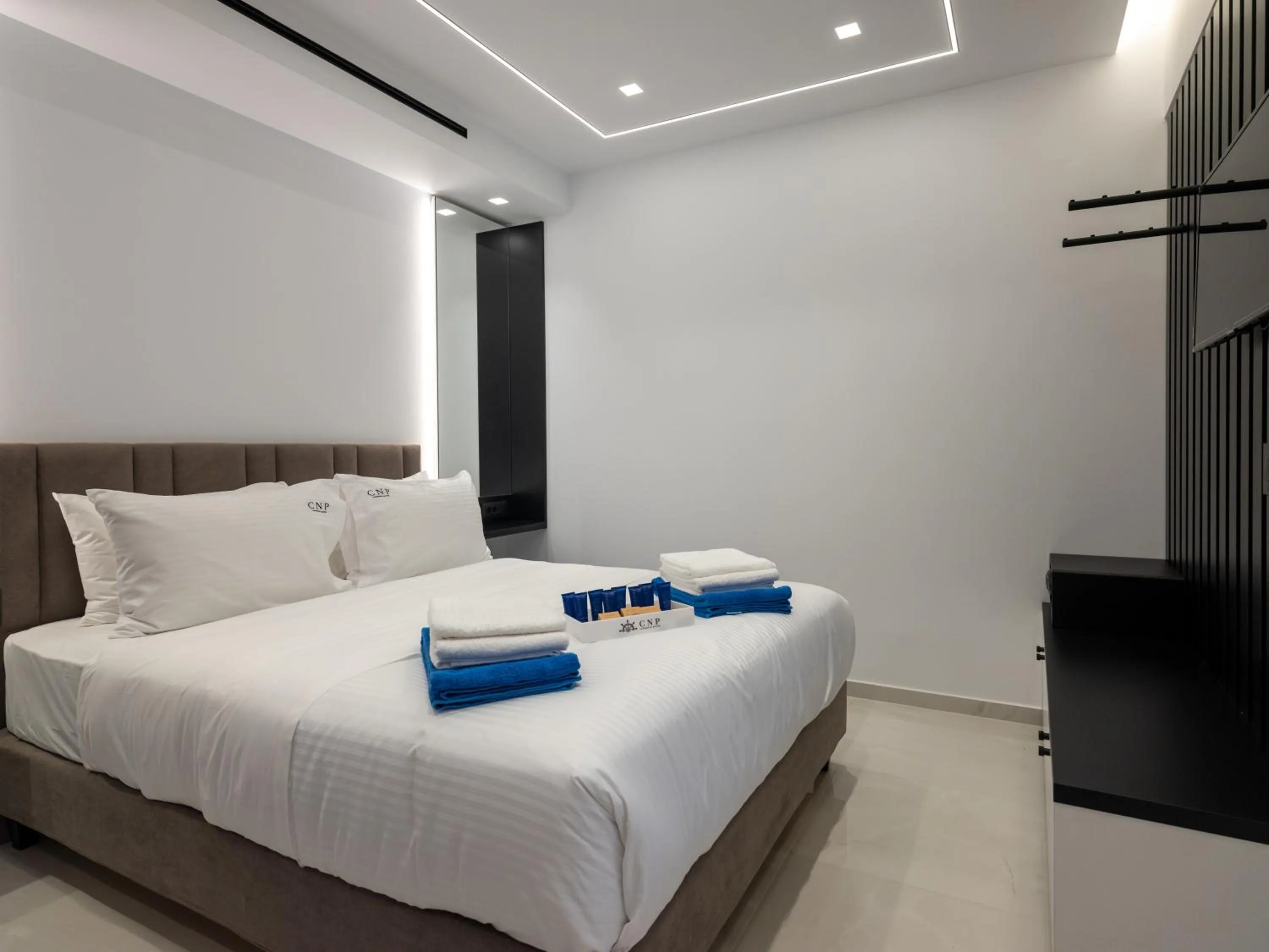 Bed in Captain Napoleon Paterakis CNP Luxurious Suites