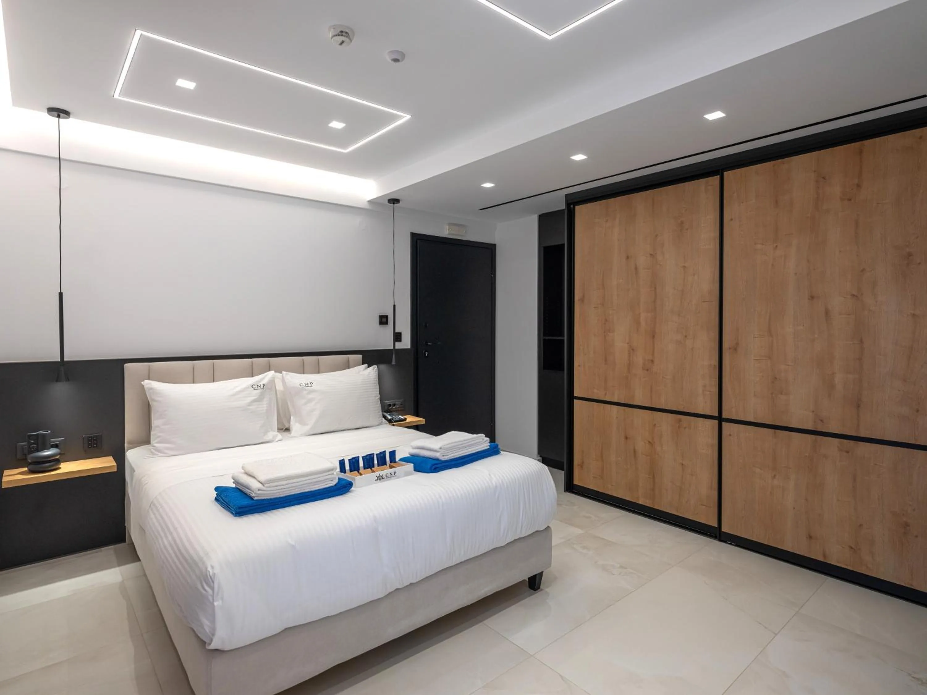 Bed in Captain Napoleon Paterakis CNP Luxurious Suites