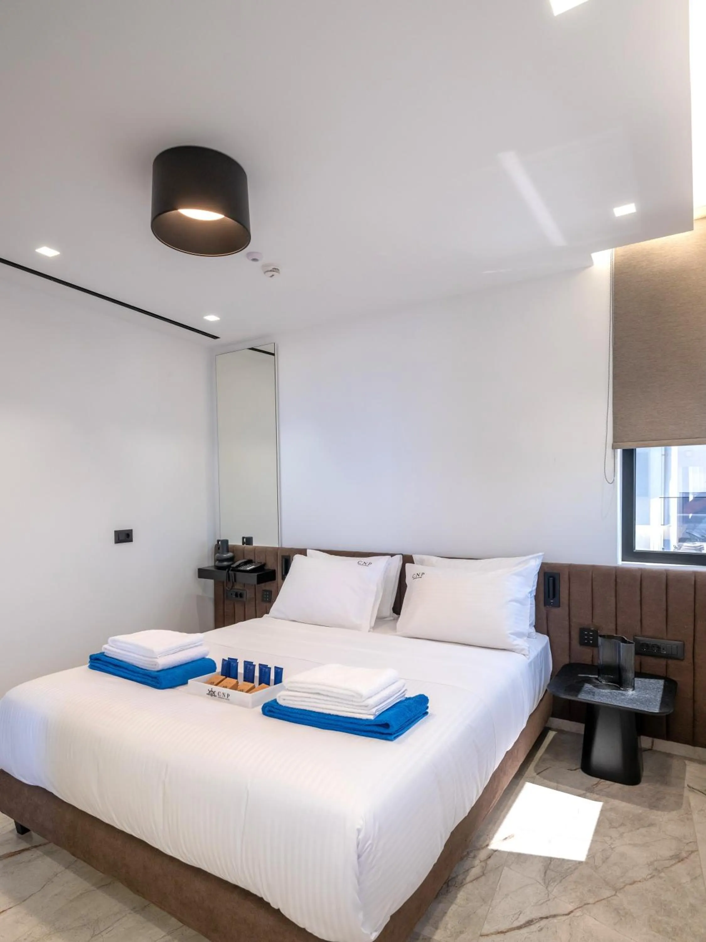 Bed in Captain Napoleon Paterakis CNP Luxurious Suites