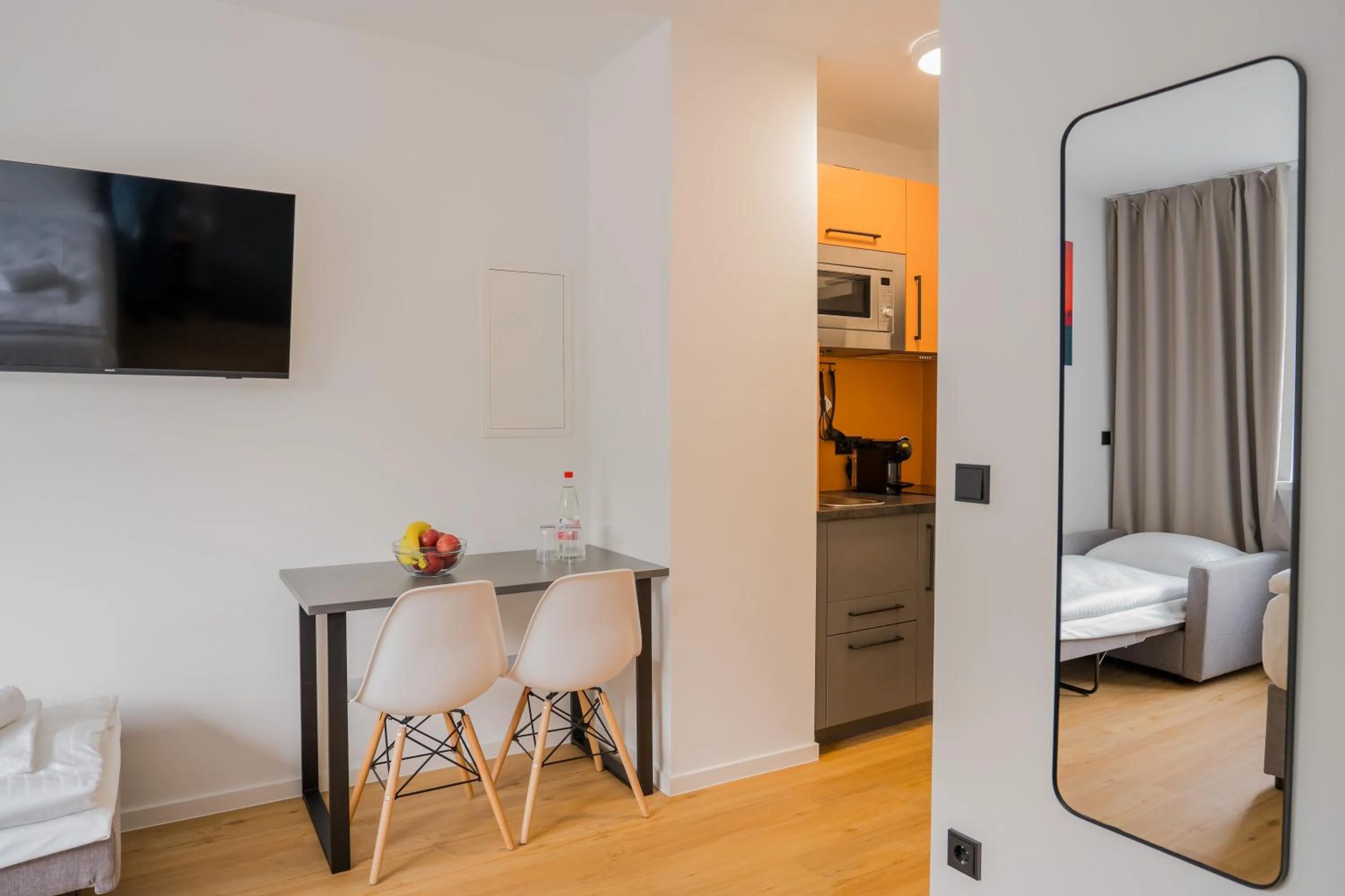 TV and multimedia, Bed in Homaris Apartments Nibelungen