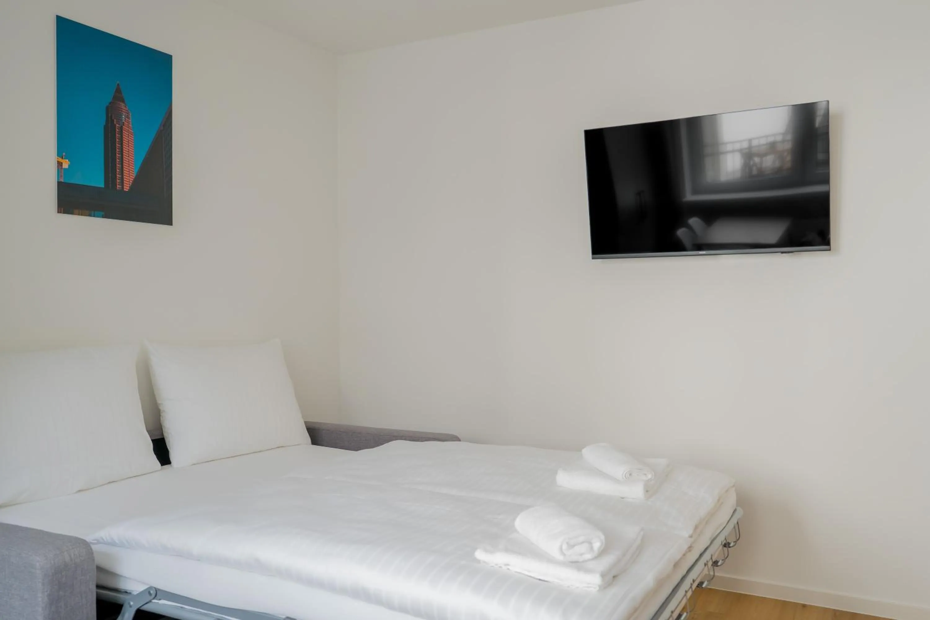 Bed in Homaris Apartments Nibelungen