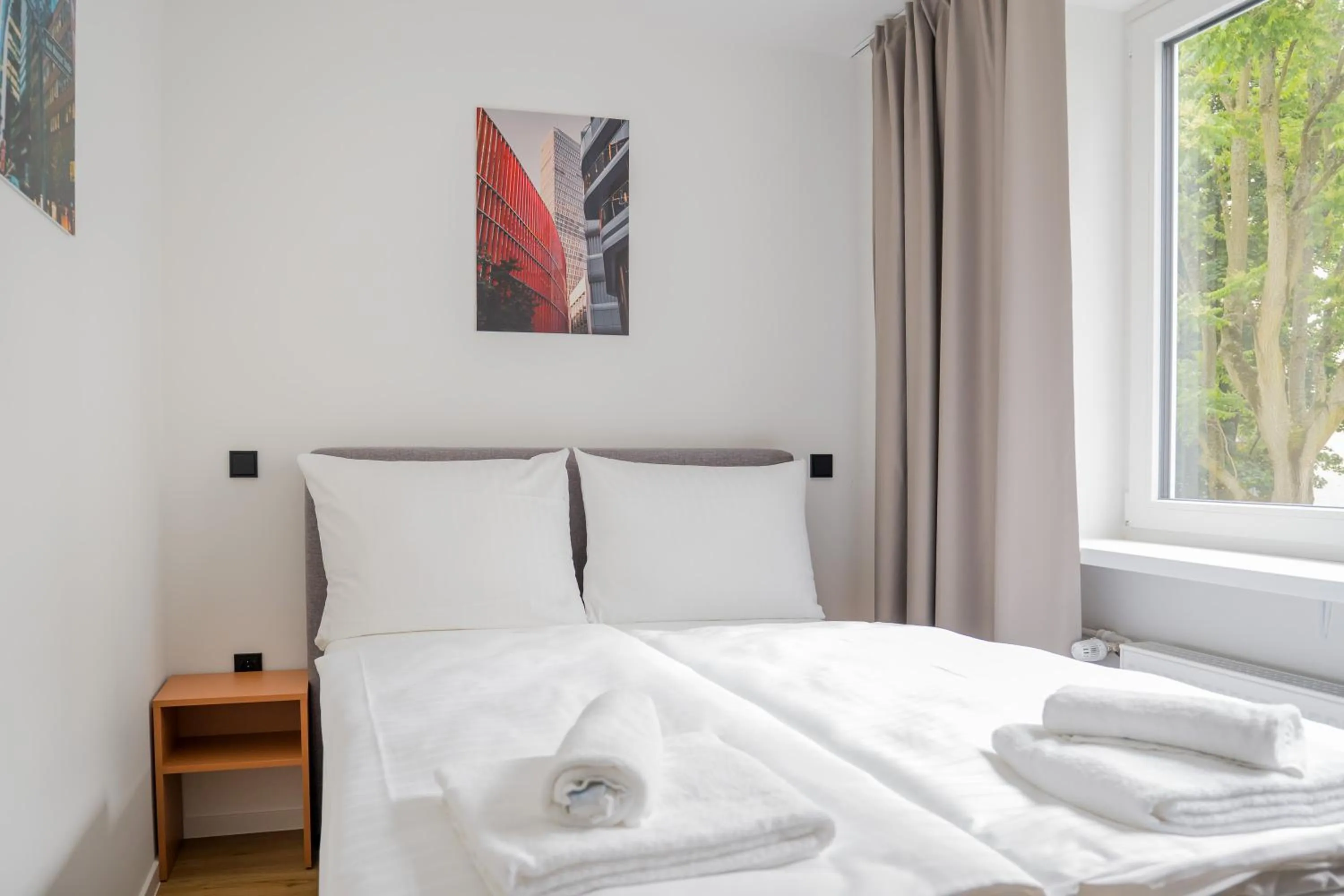 Bed in Homaris Apartments Nibelungen