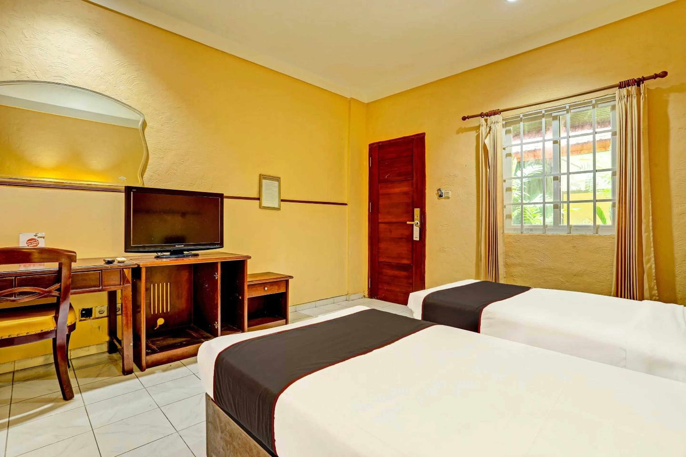 Bedroom in Collection O 91081 New Arena Hotel