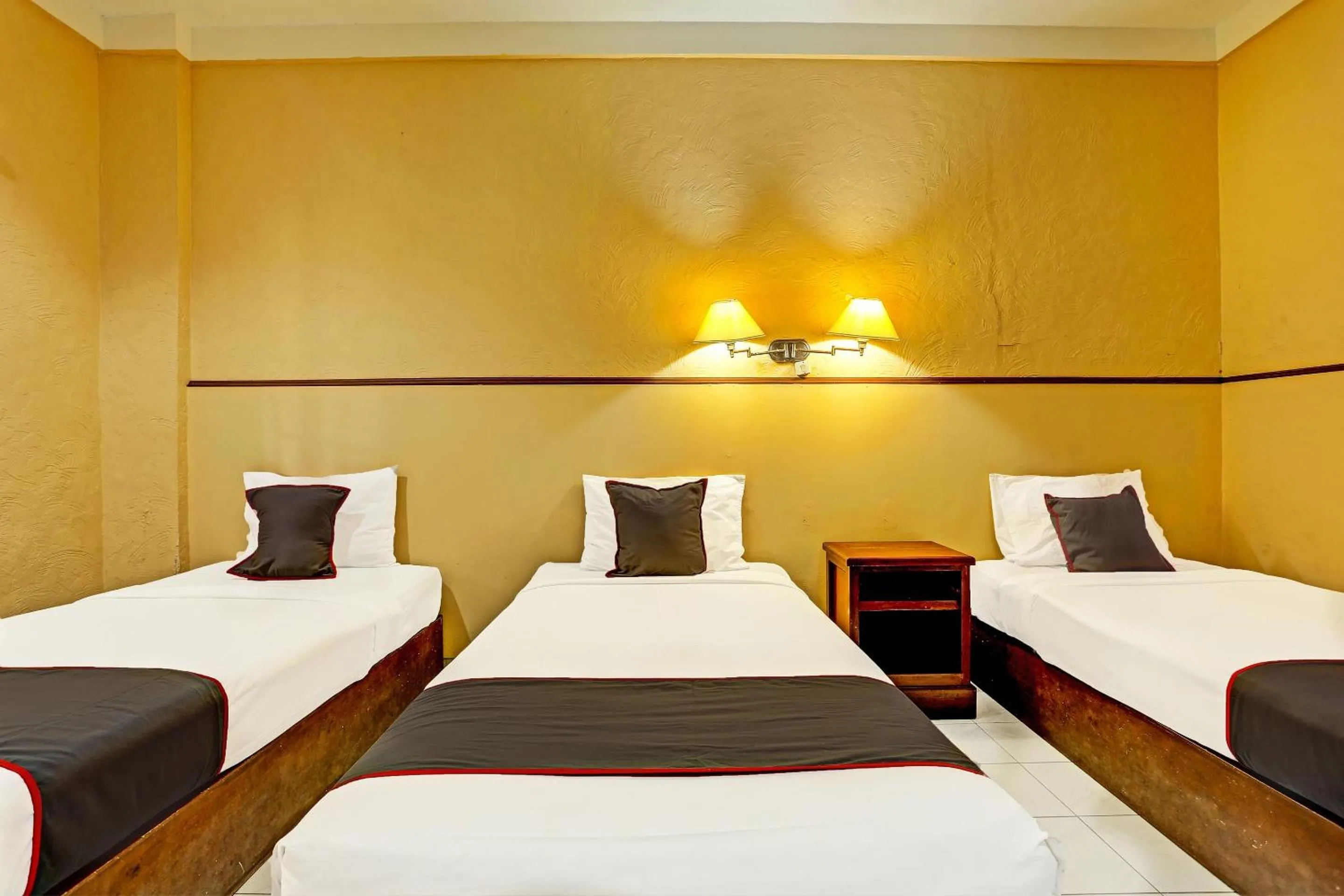 Bedroom in Collection O 91081 New Arena Hotel