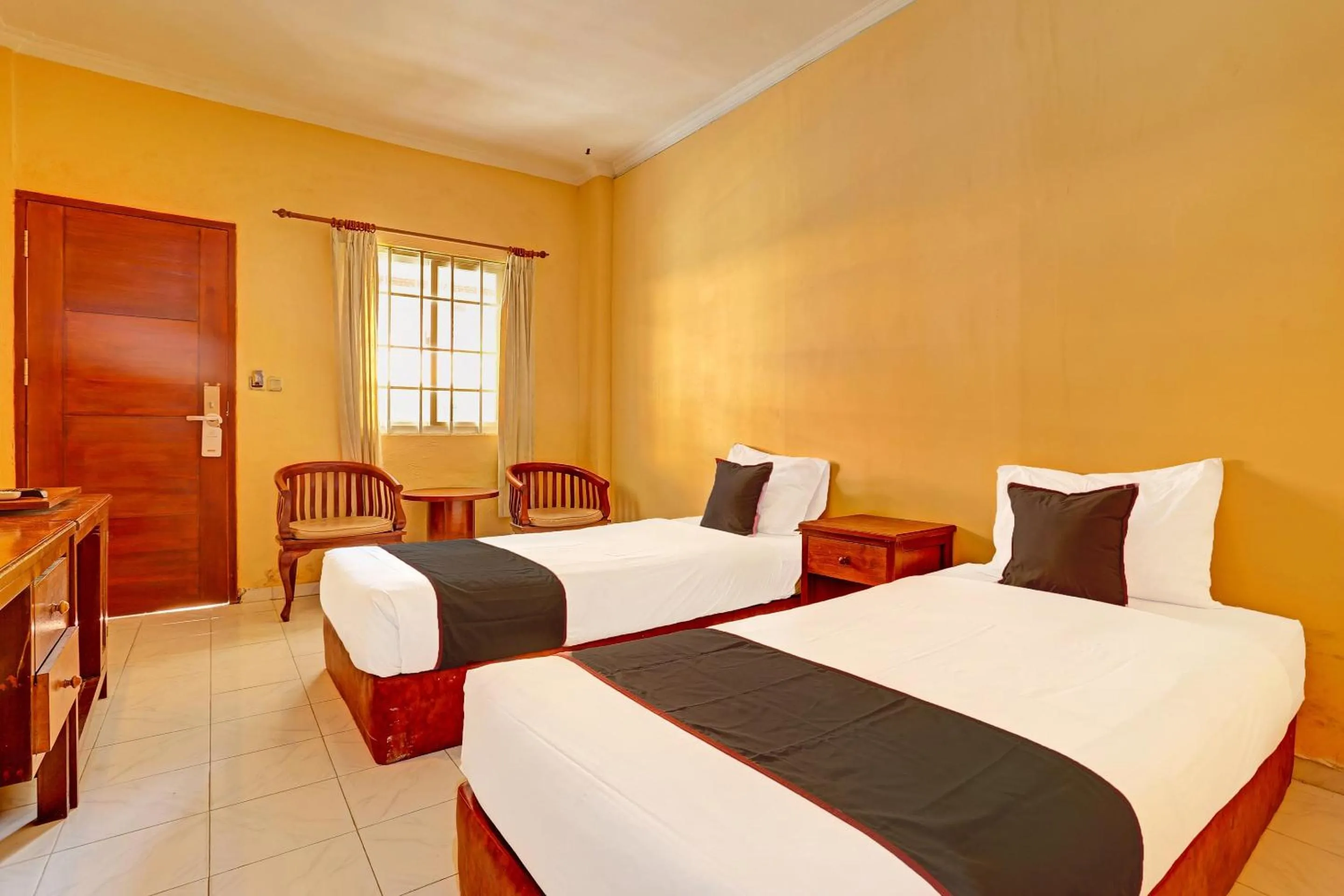 Bedroom in Collection O 91081 New Arena Hotel