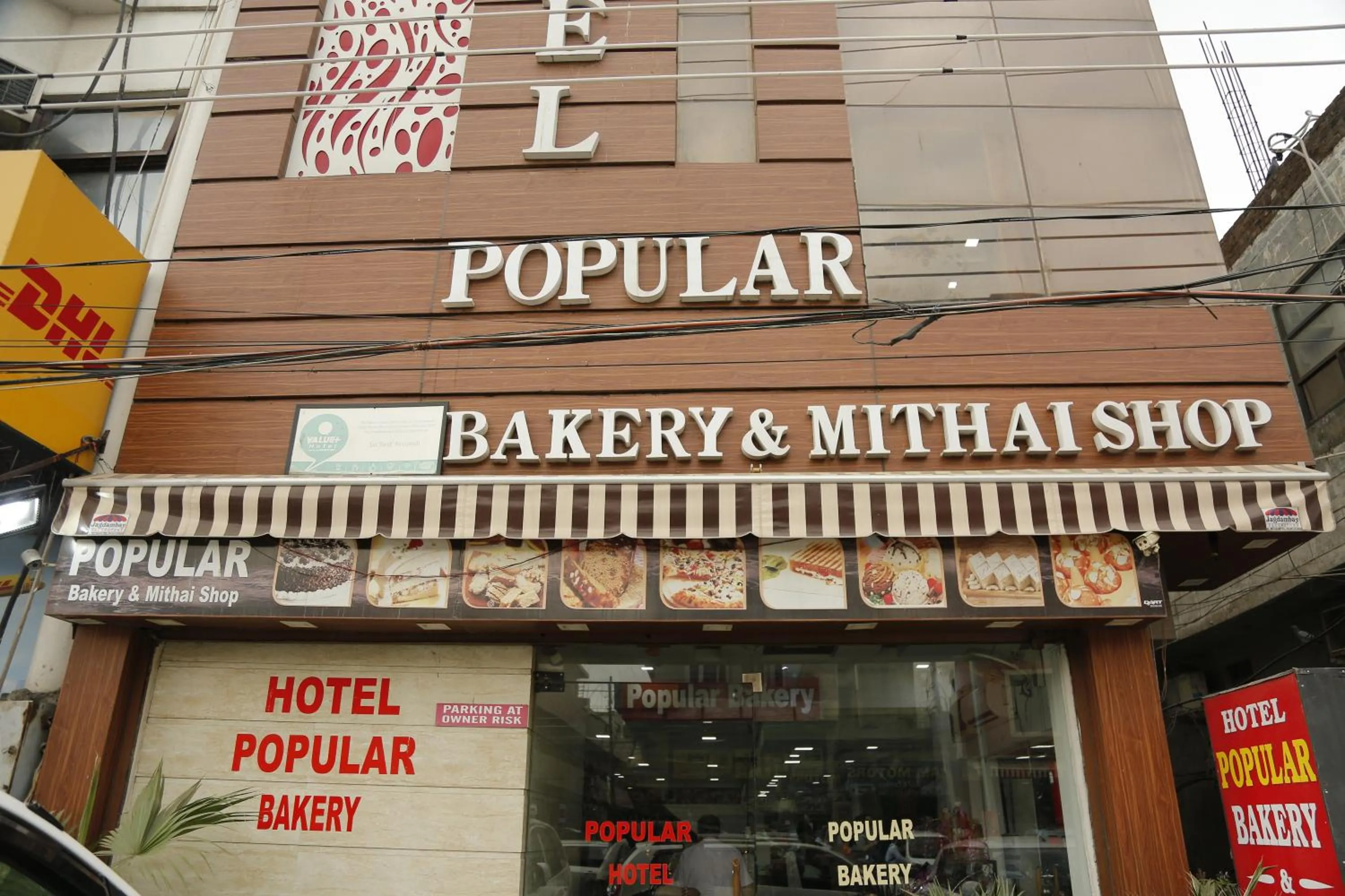 Property logo or sign in Hotel Popular