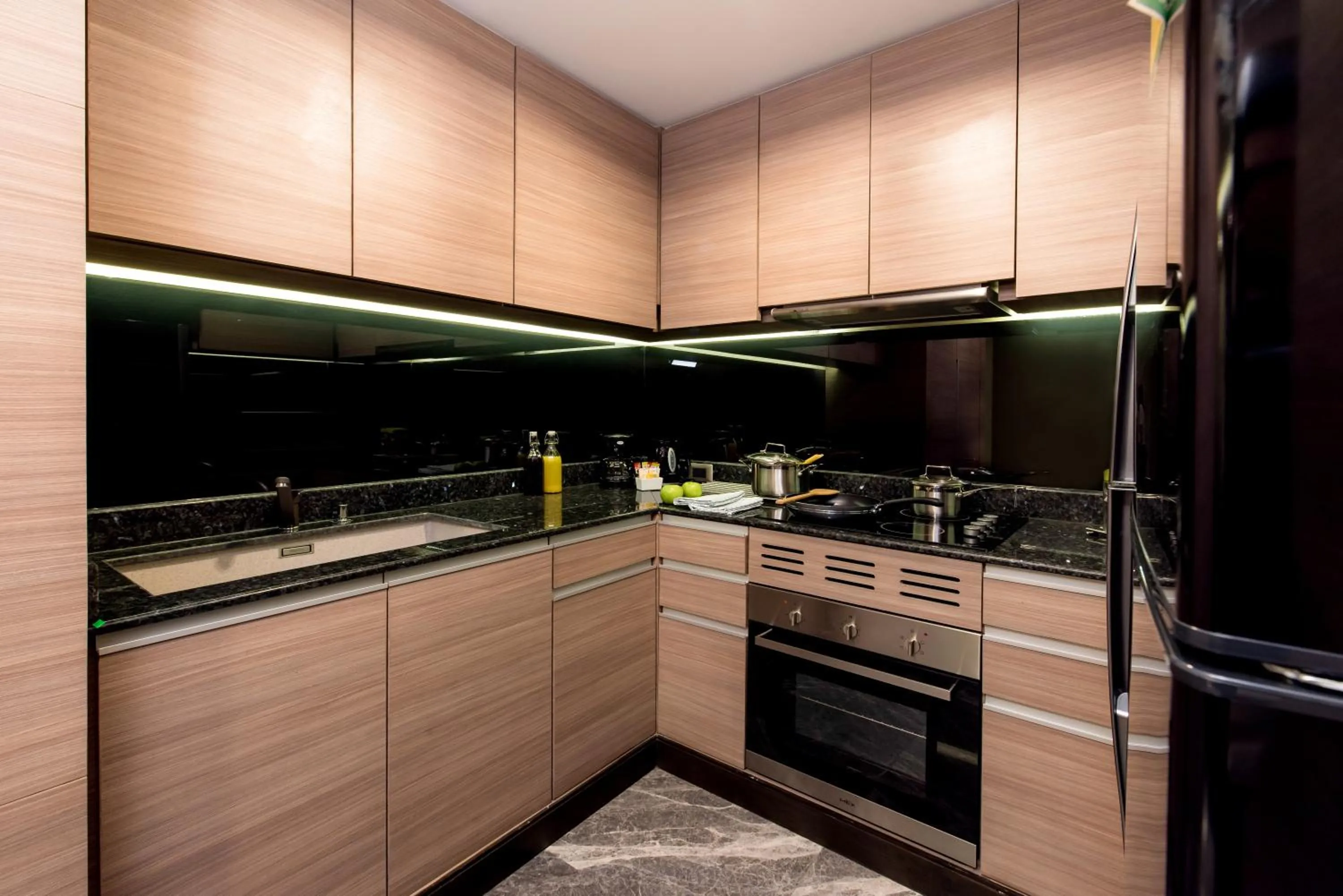 Kitchen or kitchenette in Qiss Residence by Bliston