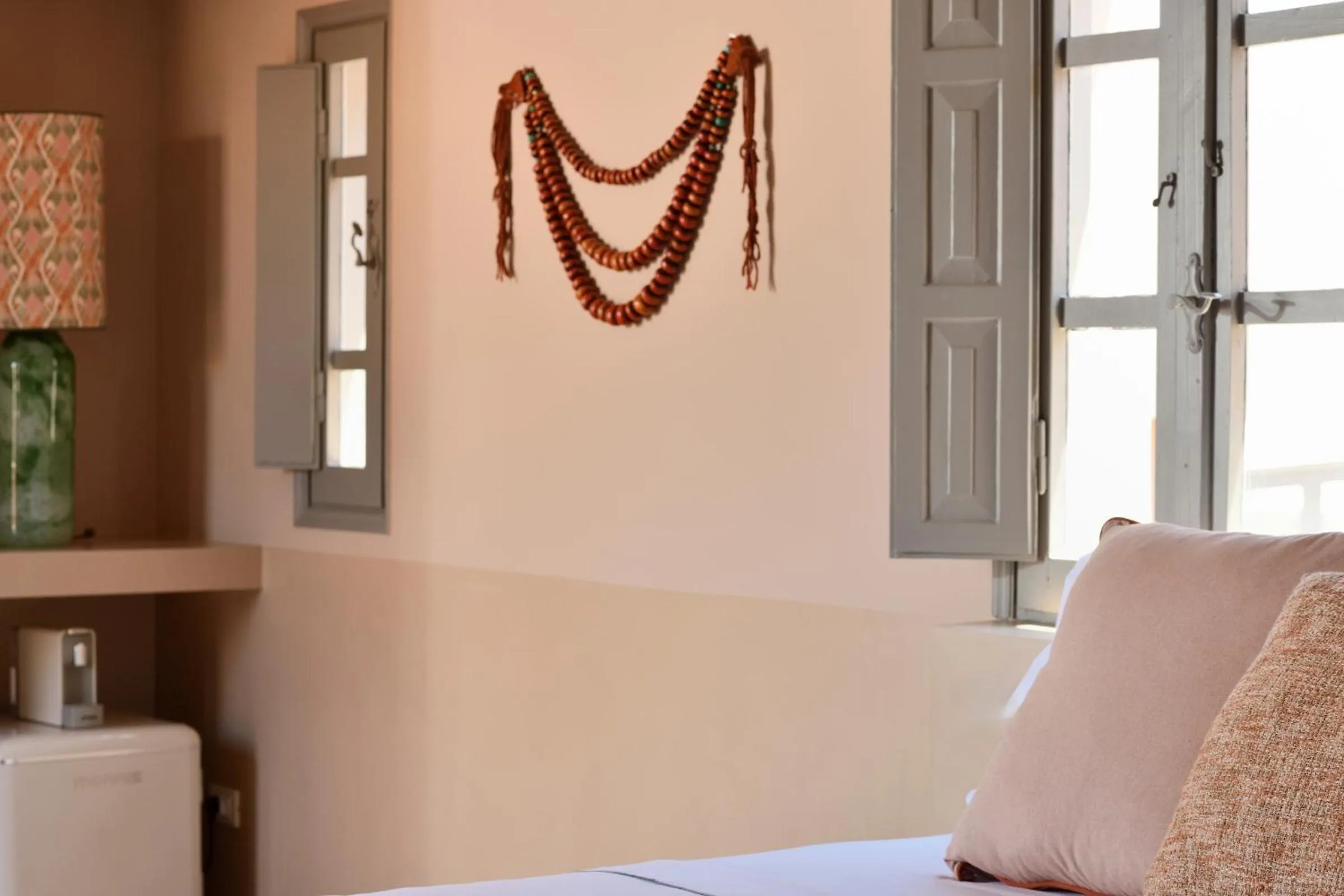 Decorative detail, Bed in Terra Verde Oia by K&K