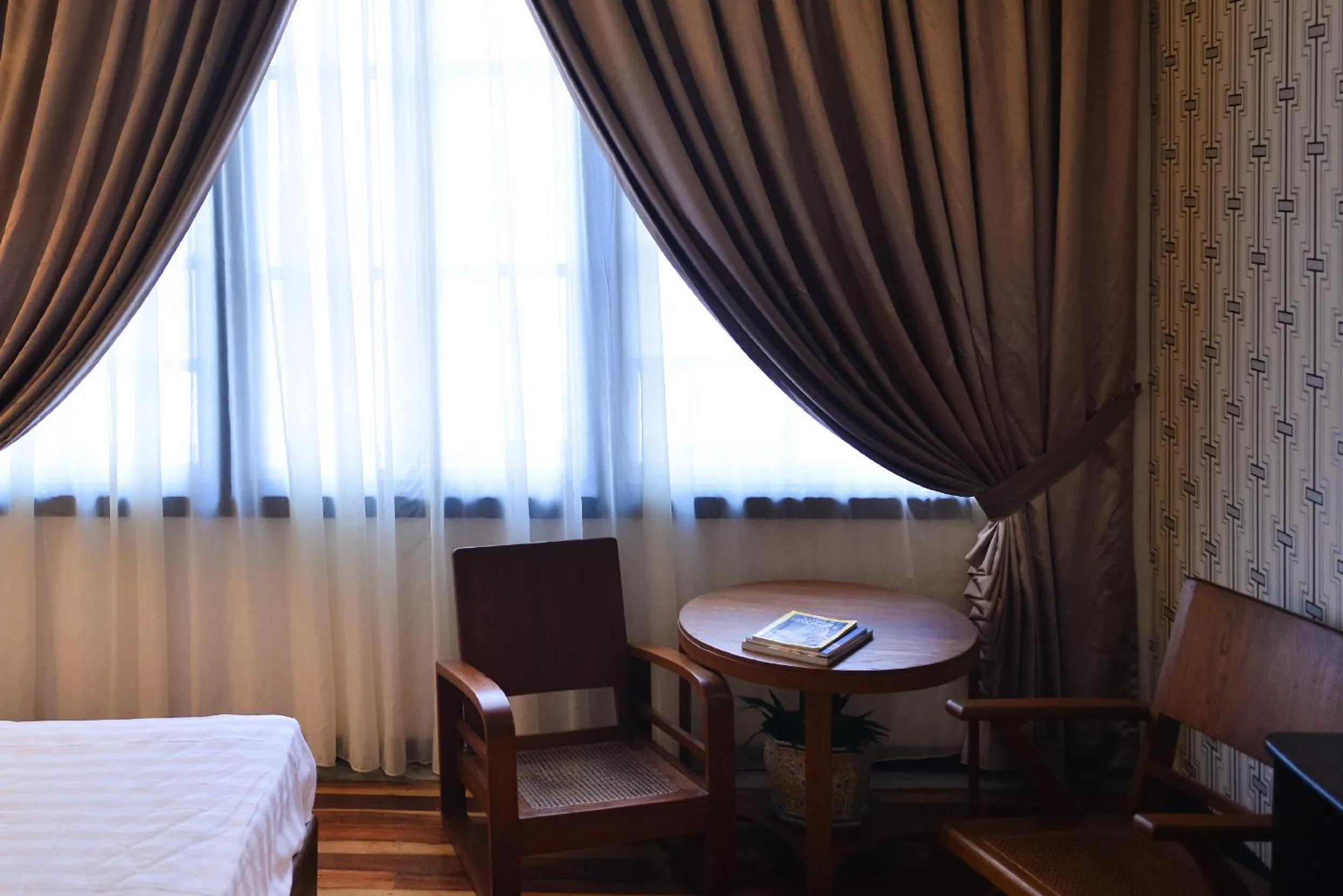 Seating area, Bed in Sarang Paloh Heritage Stay
