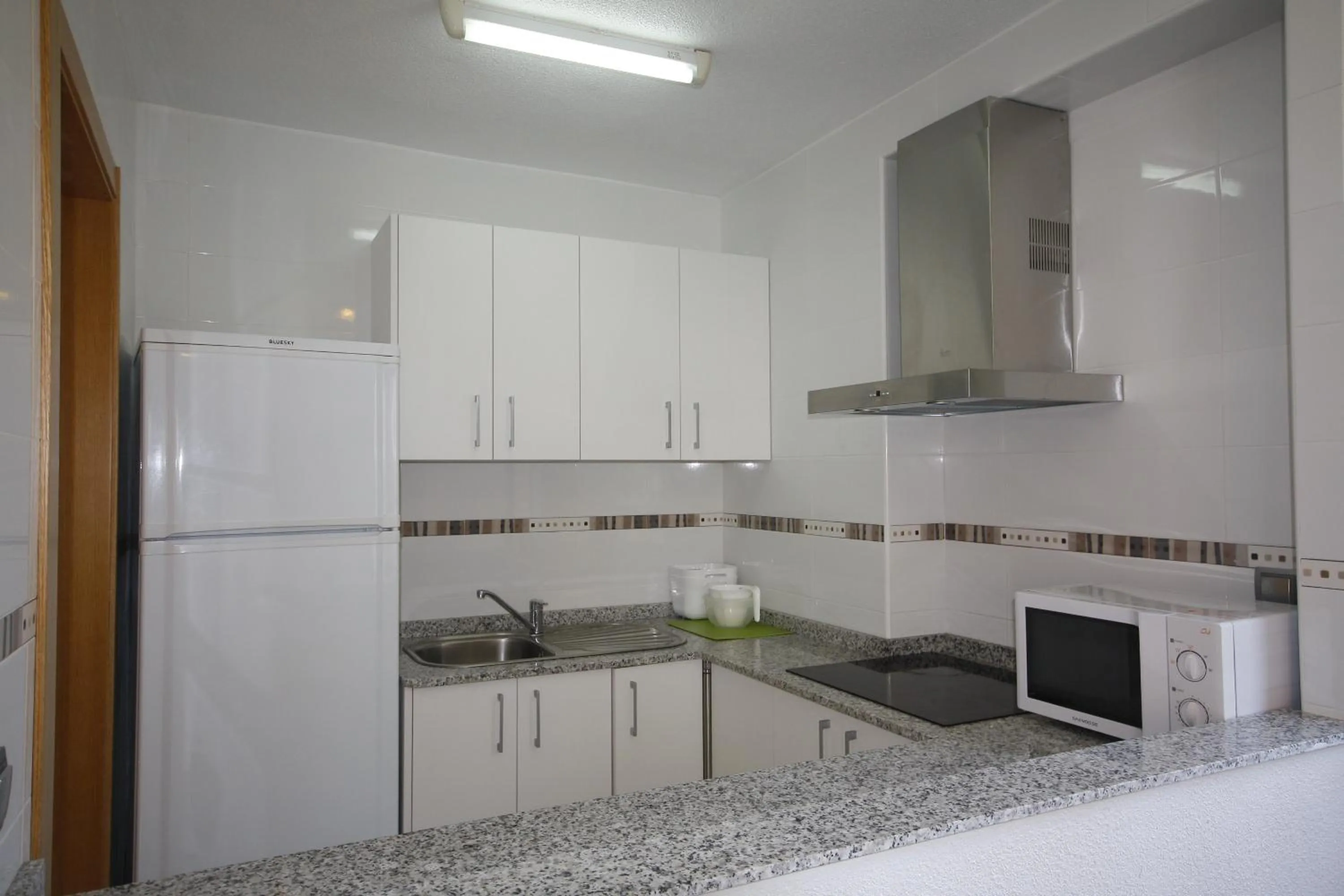 Kitchen or kitchenette in Apartamentos Maysan