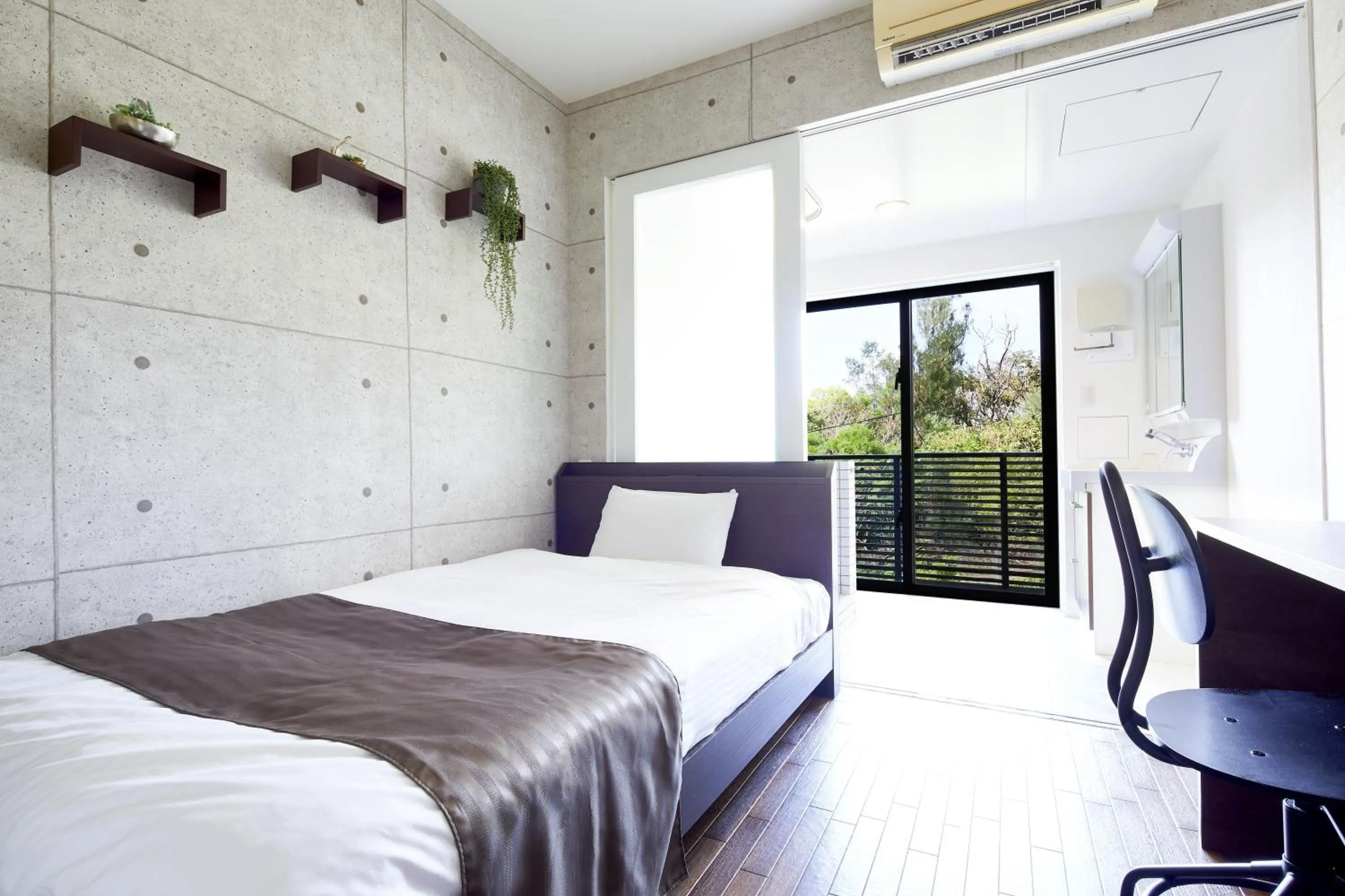 Bed in E-horizon Resort Condominium Sesoko