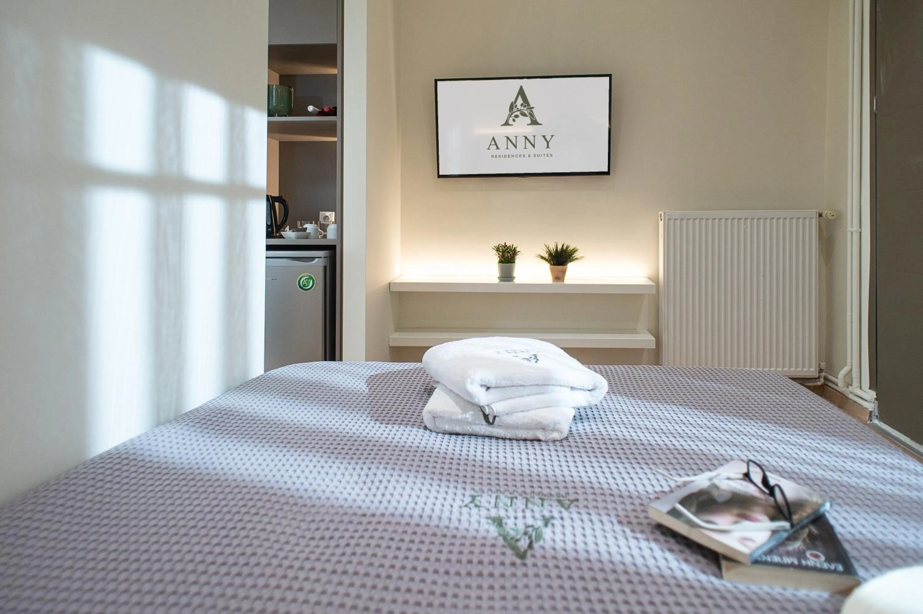 Bed in Anny's Residences & Suites