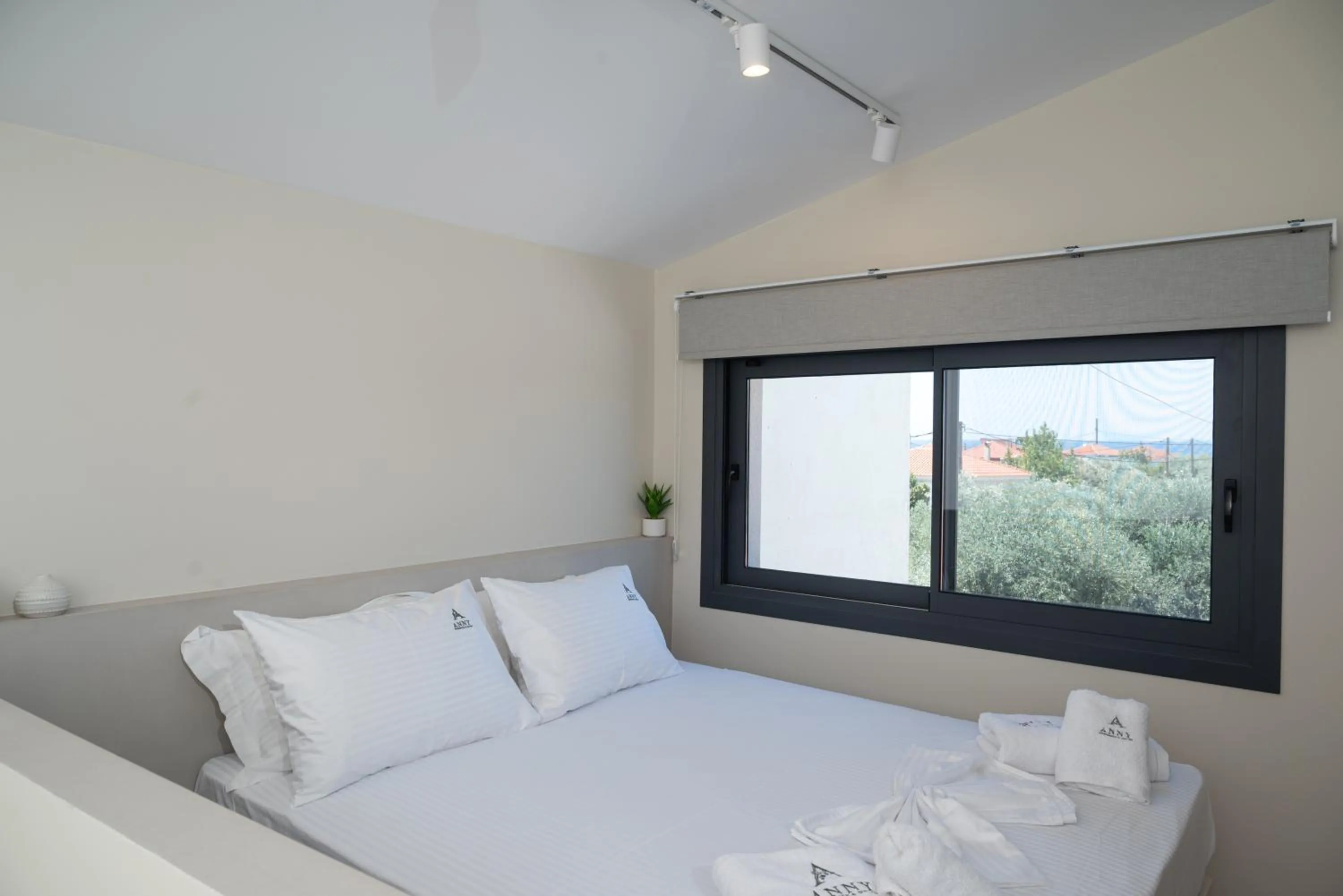 Bed in Anny's Residences & Suites