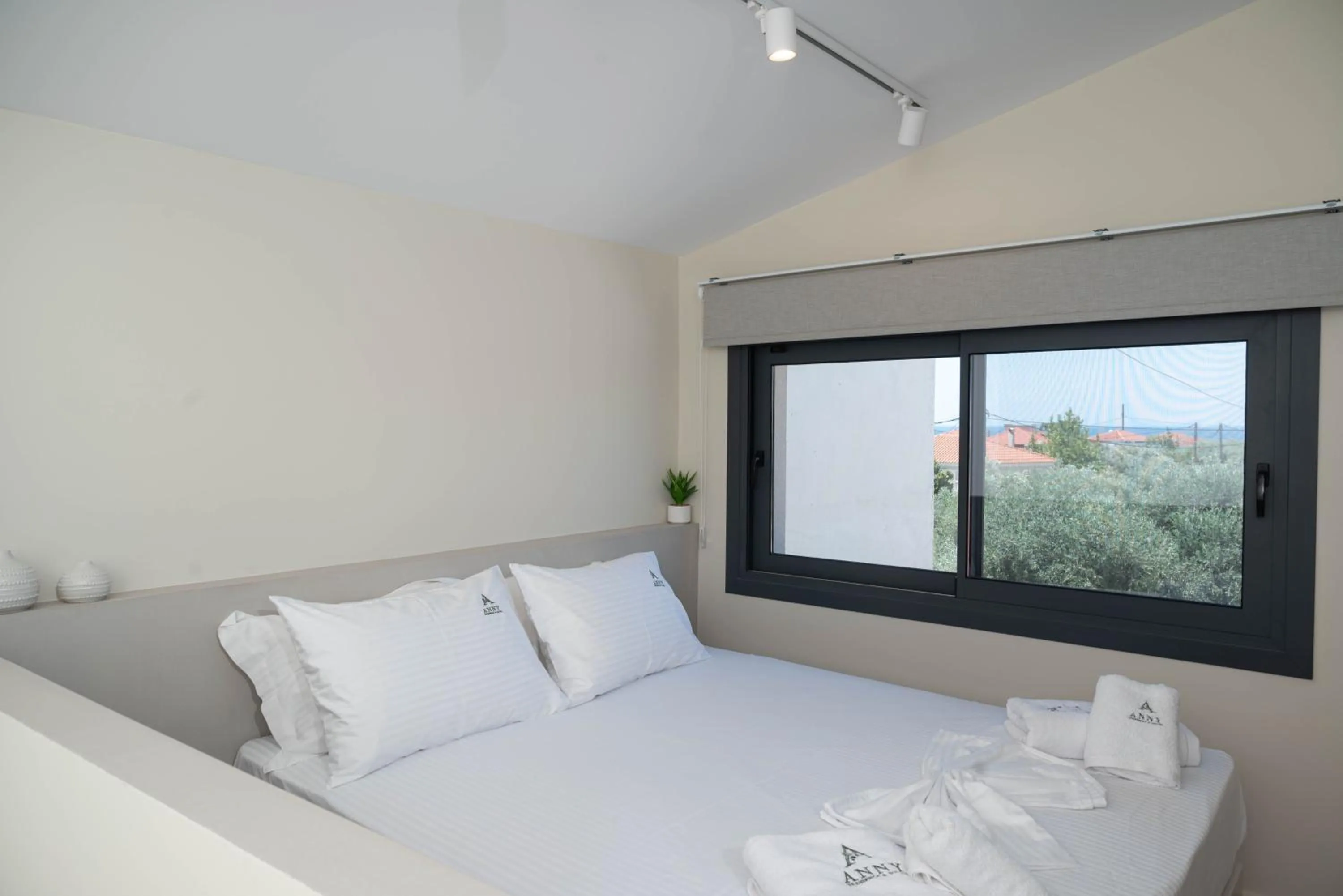 Bed in Anny's Residences & Suites