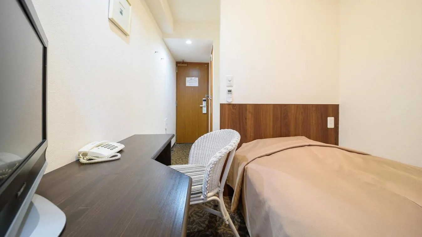 Bed in New Gloria Oita Hotel