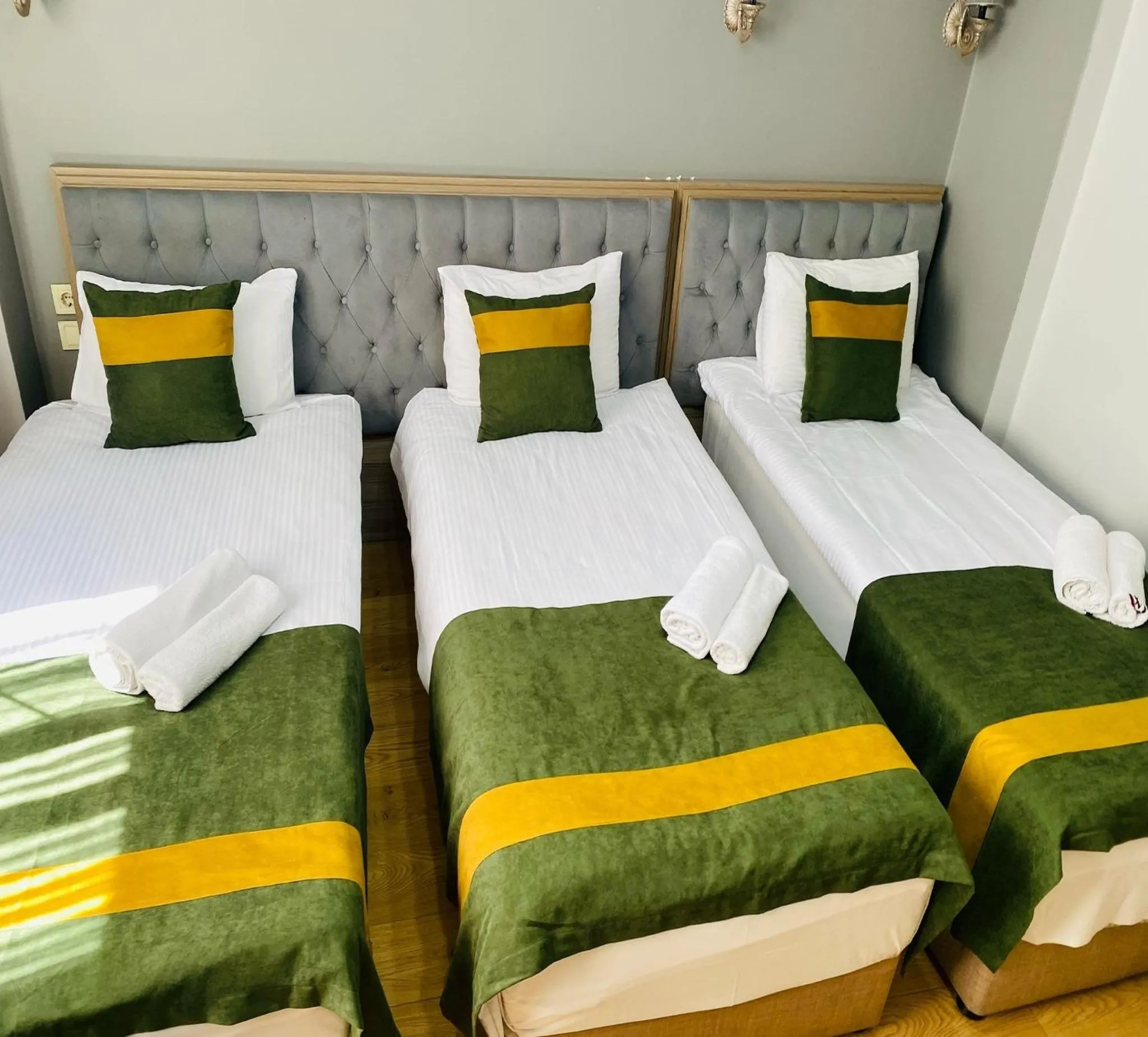 Bed in Unique Suite Hotel