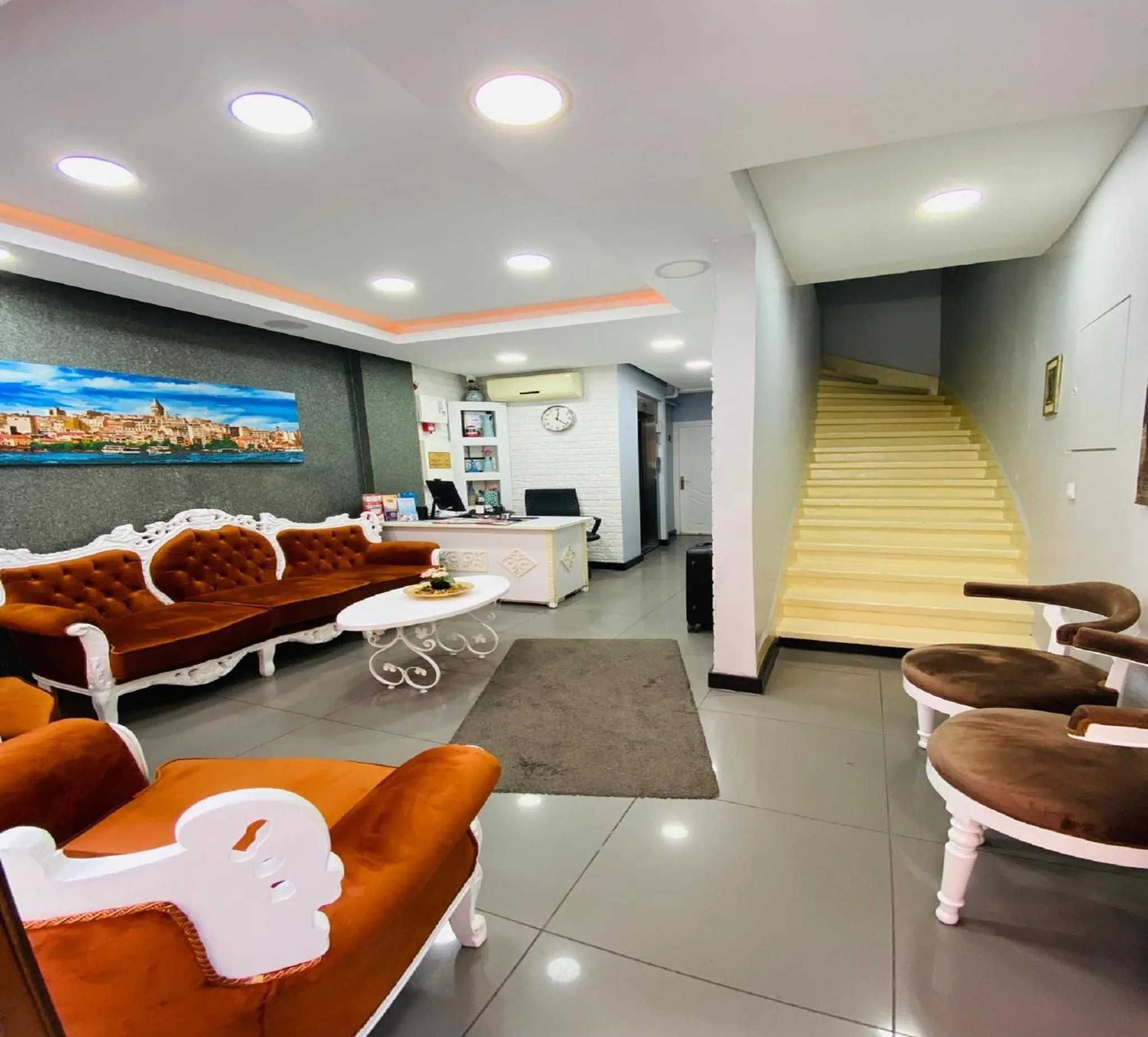 Lobby or reception in Unique Suite Hotel