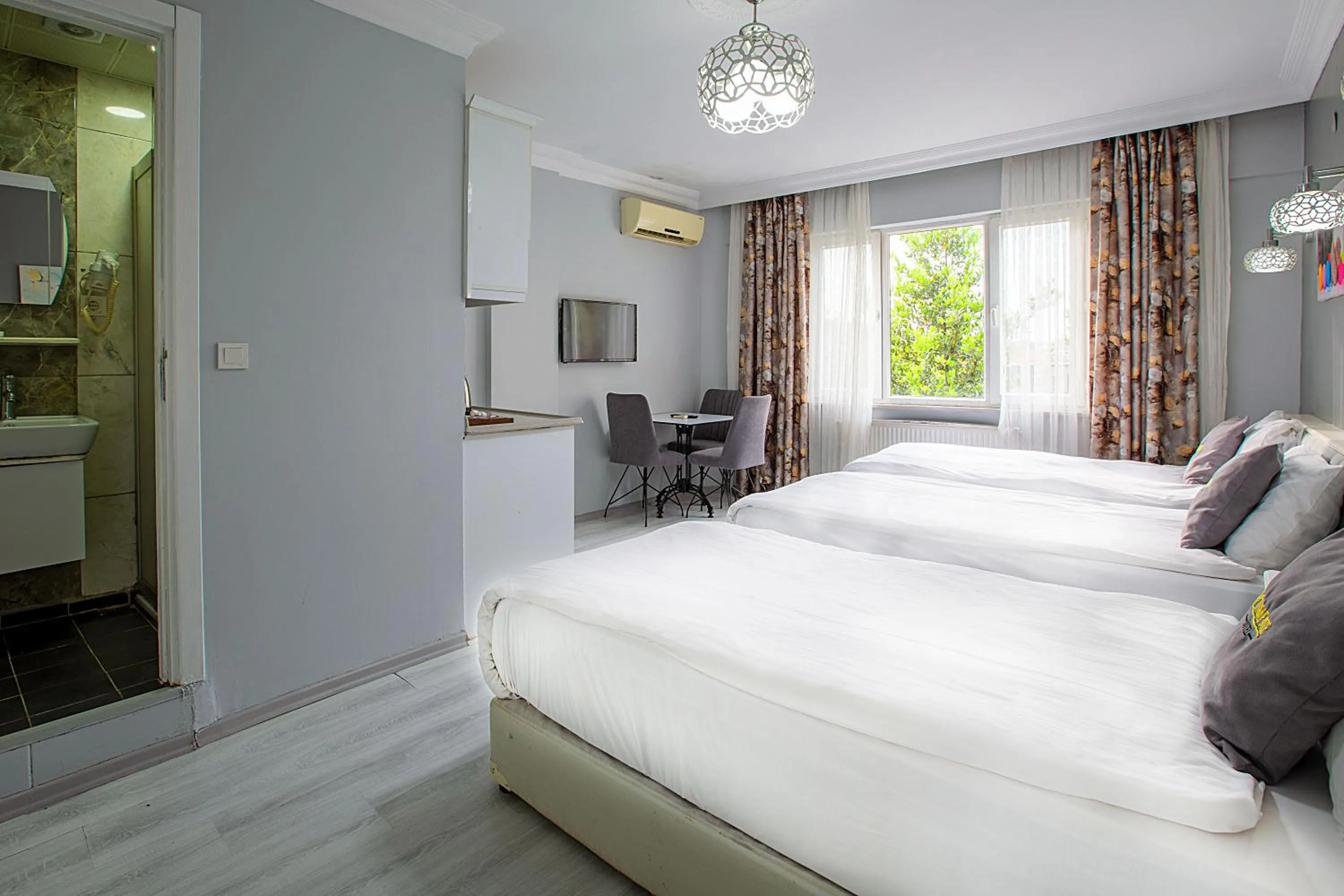 Bed in Unique Suite Hotel