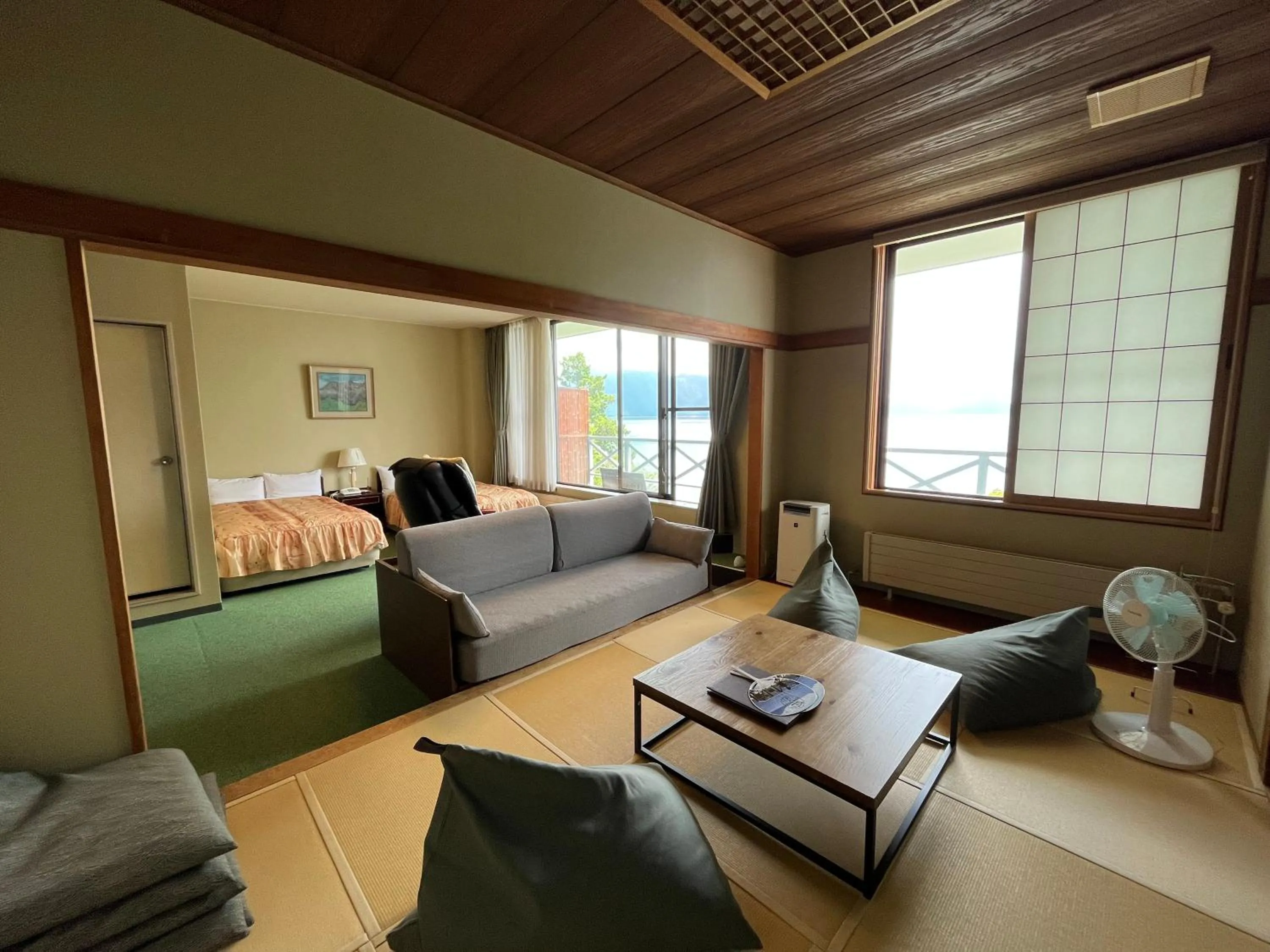 Living room, Bed in Sapporo's Secret Onsen Sanctuary Marukoma Onsen Ryokan