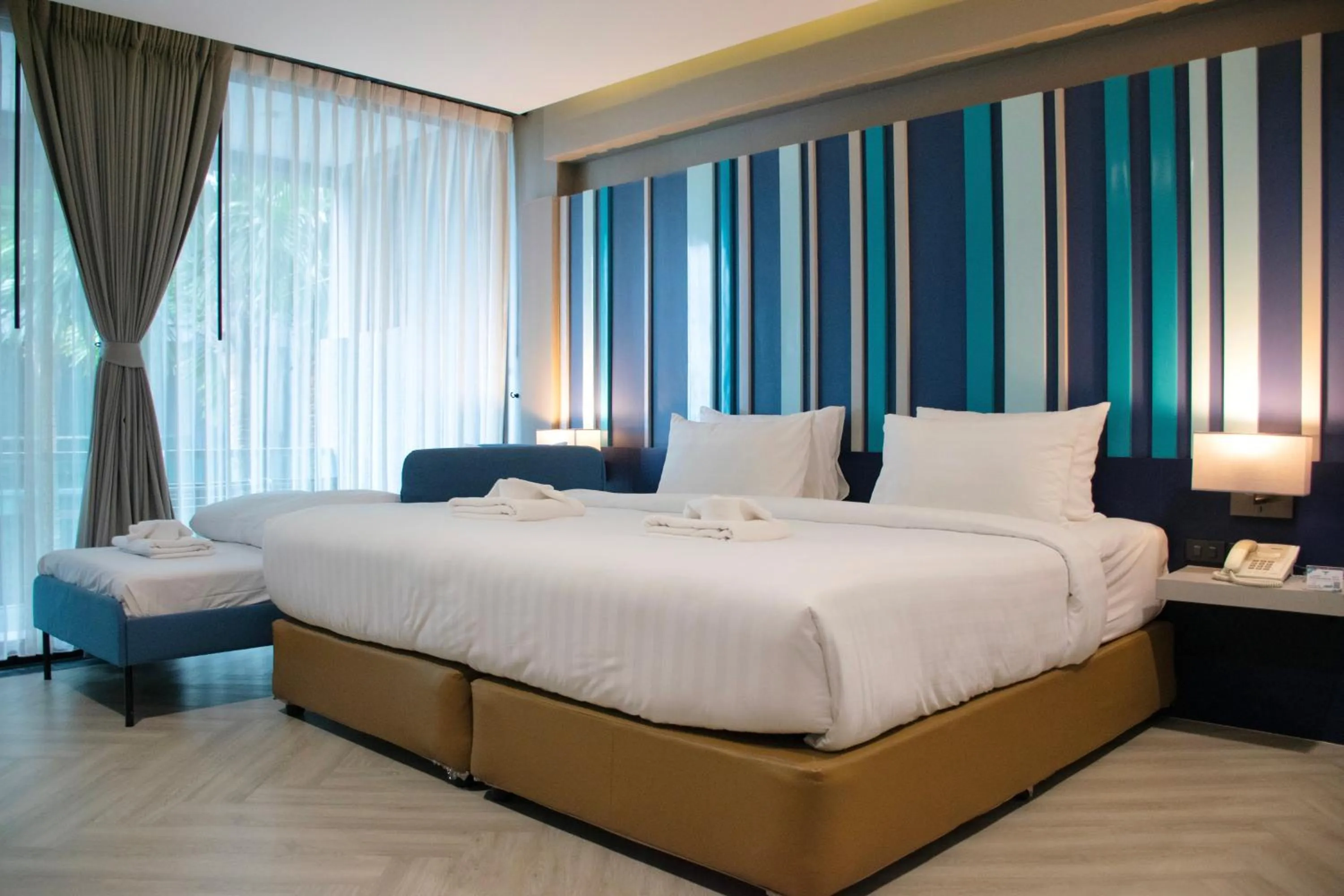 Bed in @T Boutique Hotel