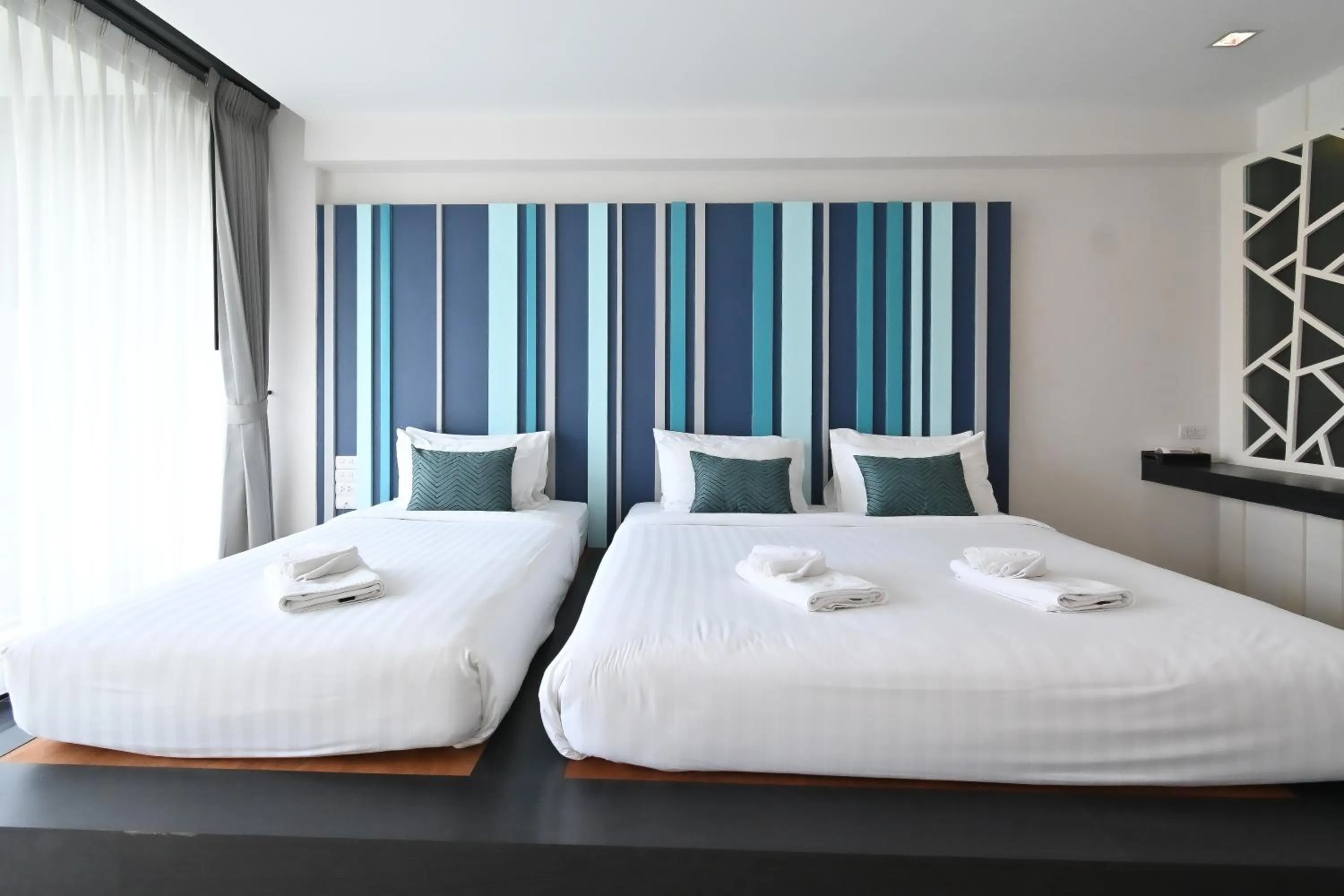 Bed in @T Boutique Hotel