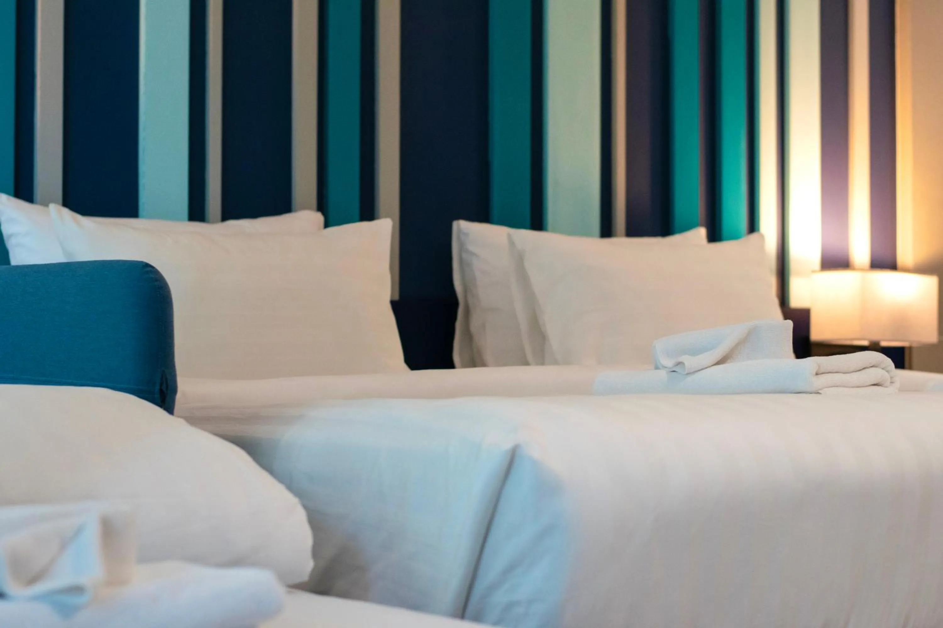 Bed in @T Boutique Hotel