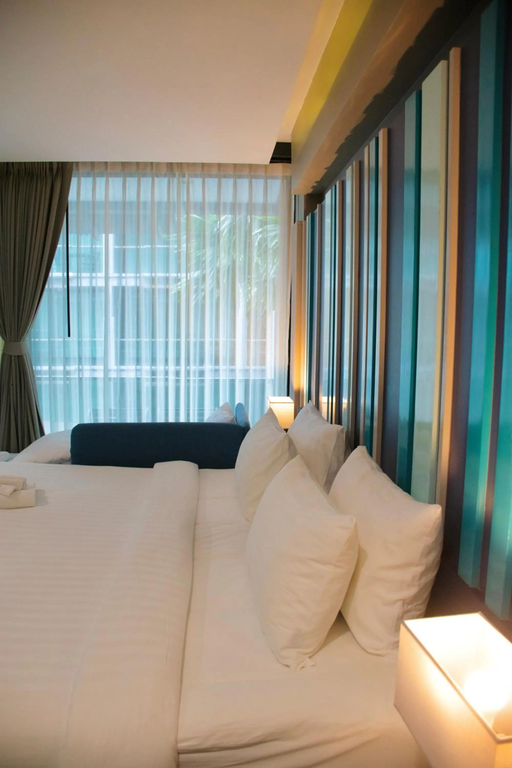 Bed in @T Boutique Hotel