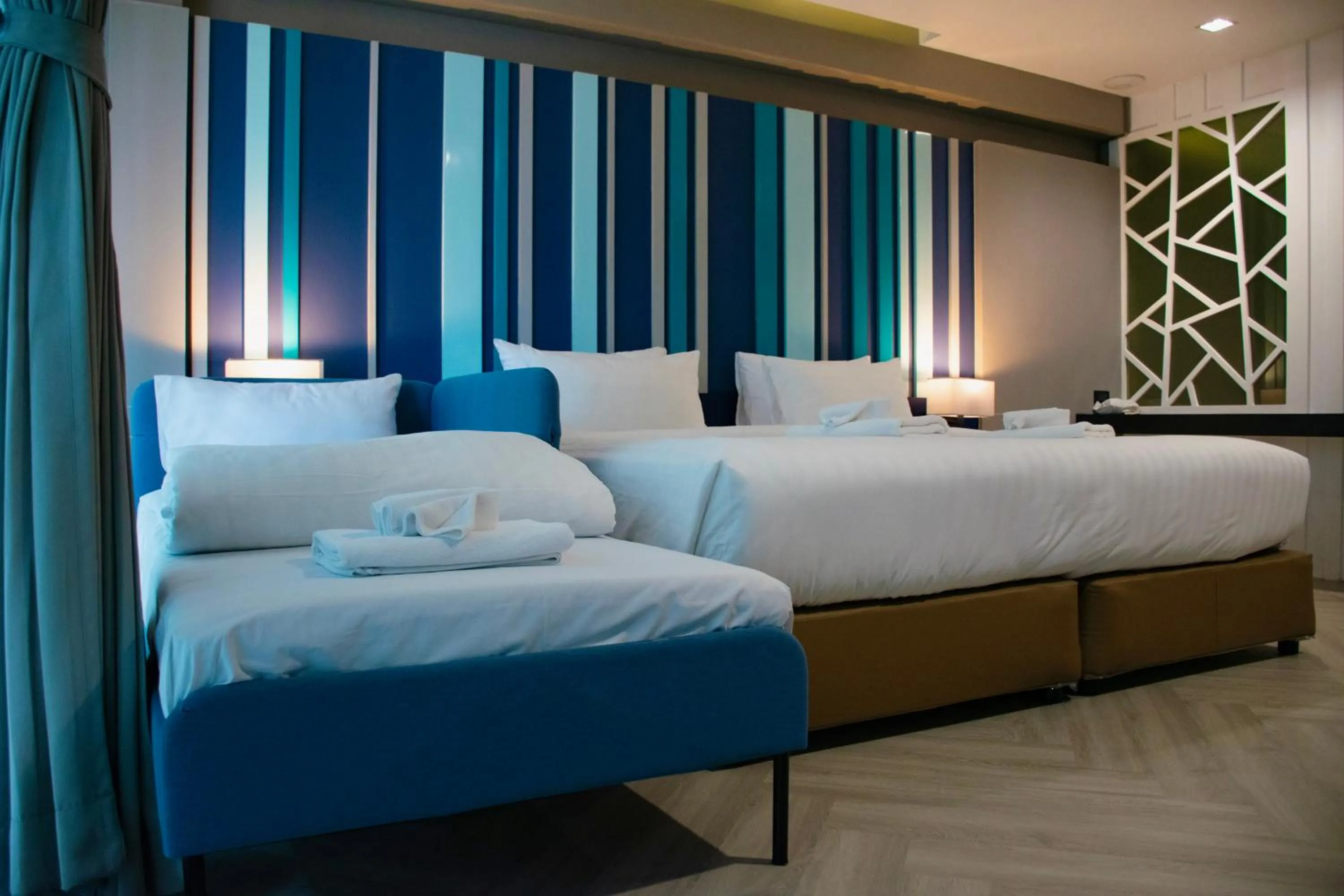 Bed in @T Boutique Hotel