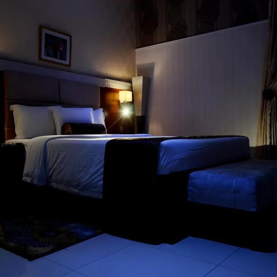 Bed in Nippon Grand Hotel and Apartment