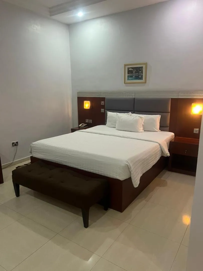 Bed in Nippon Grand Hotel and Apartment