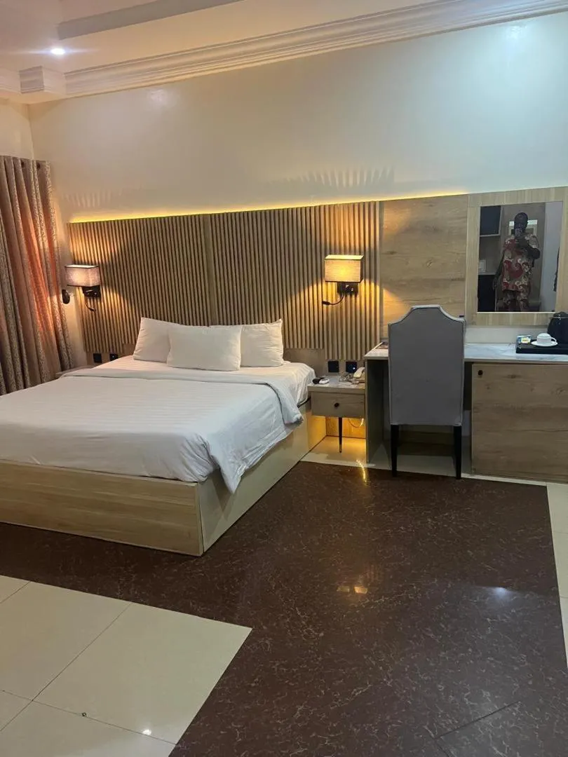 Bed in Nippon Grand Hotel and Apartment