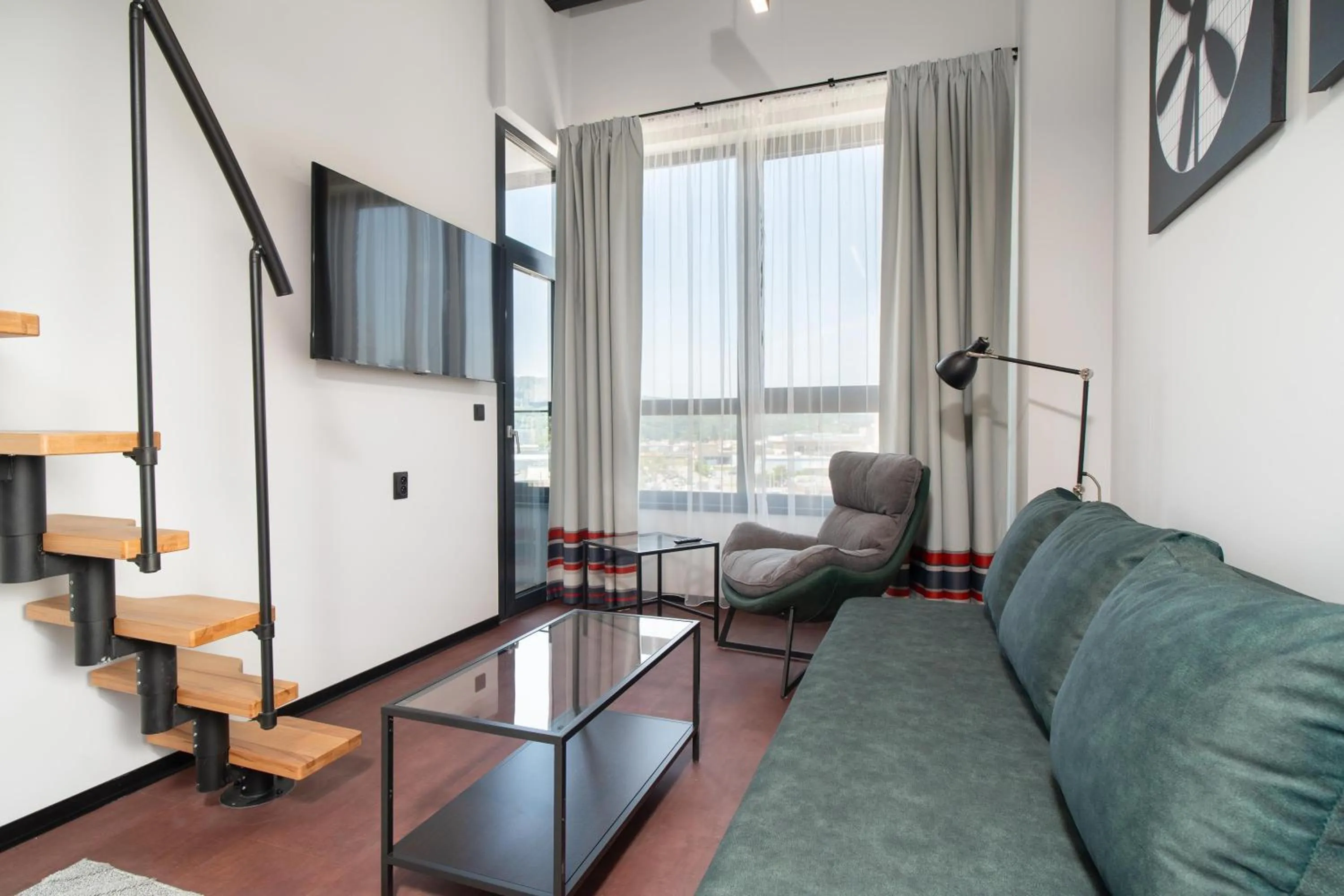 Two-Bedroom Loft Apartment with One Double and Two Single Beds, Sofa Bed and Balcony in Best Western Hotel Presov