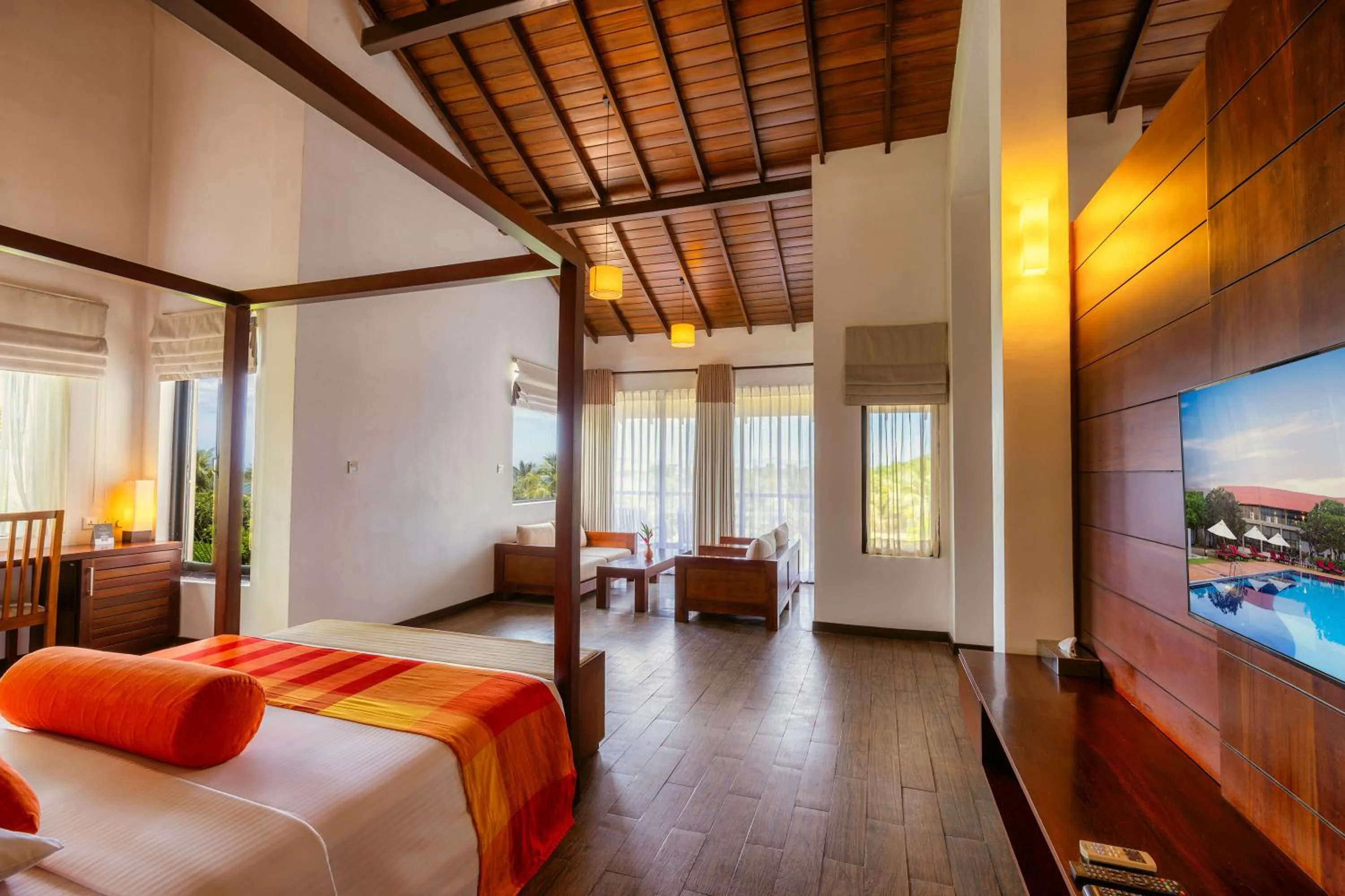 Communal lounge/ TV room, Bed in The Calm Resort & Spa