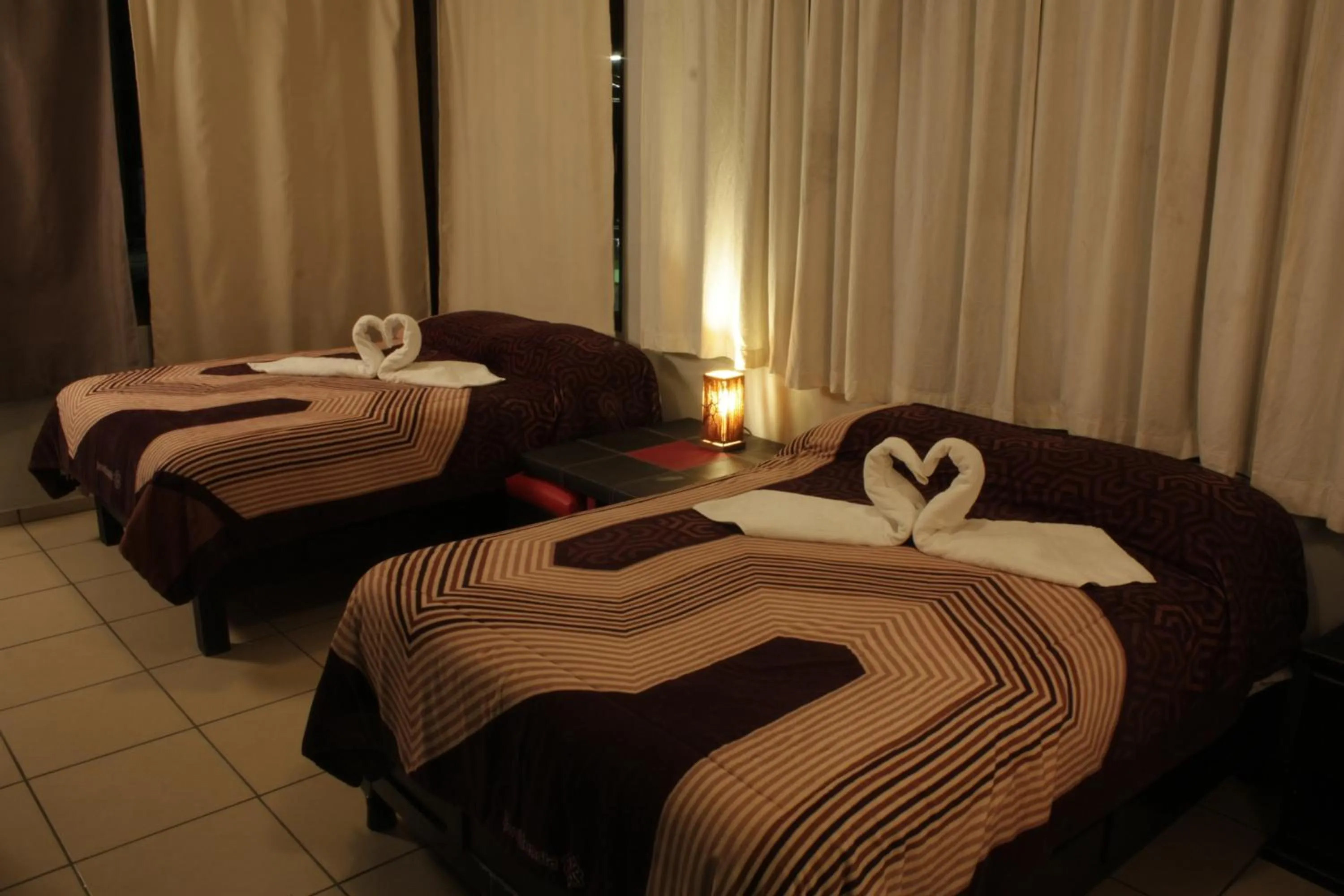 Bed in Telpochcalli Hotel & Temazcal