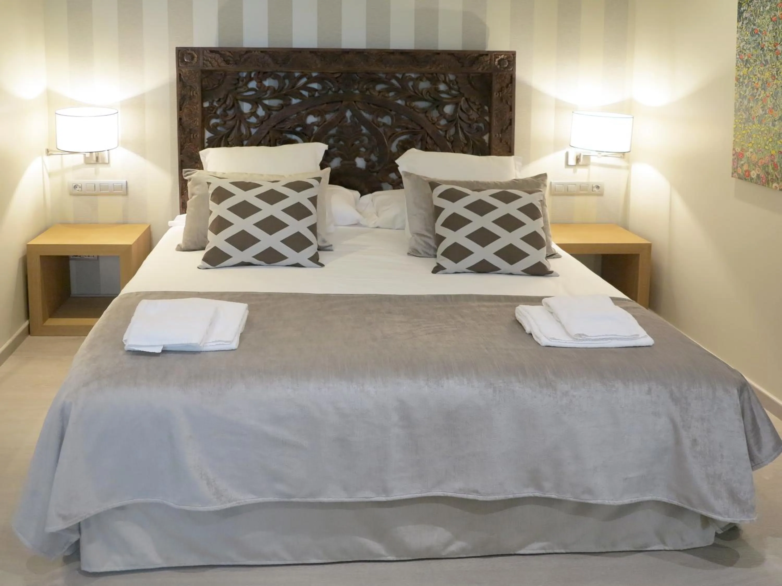 Bed in Serennia Exclusive Rooms