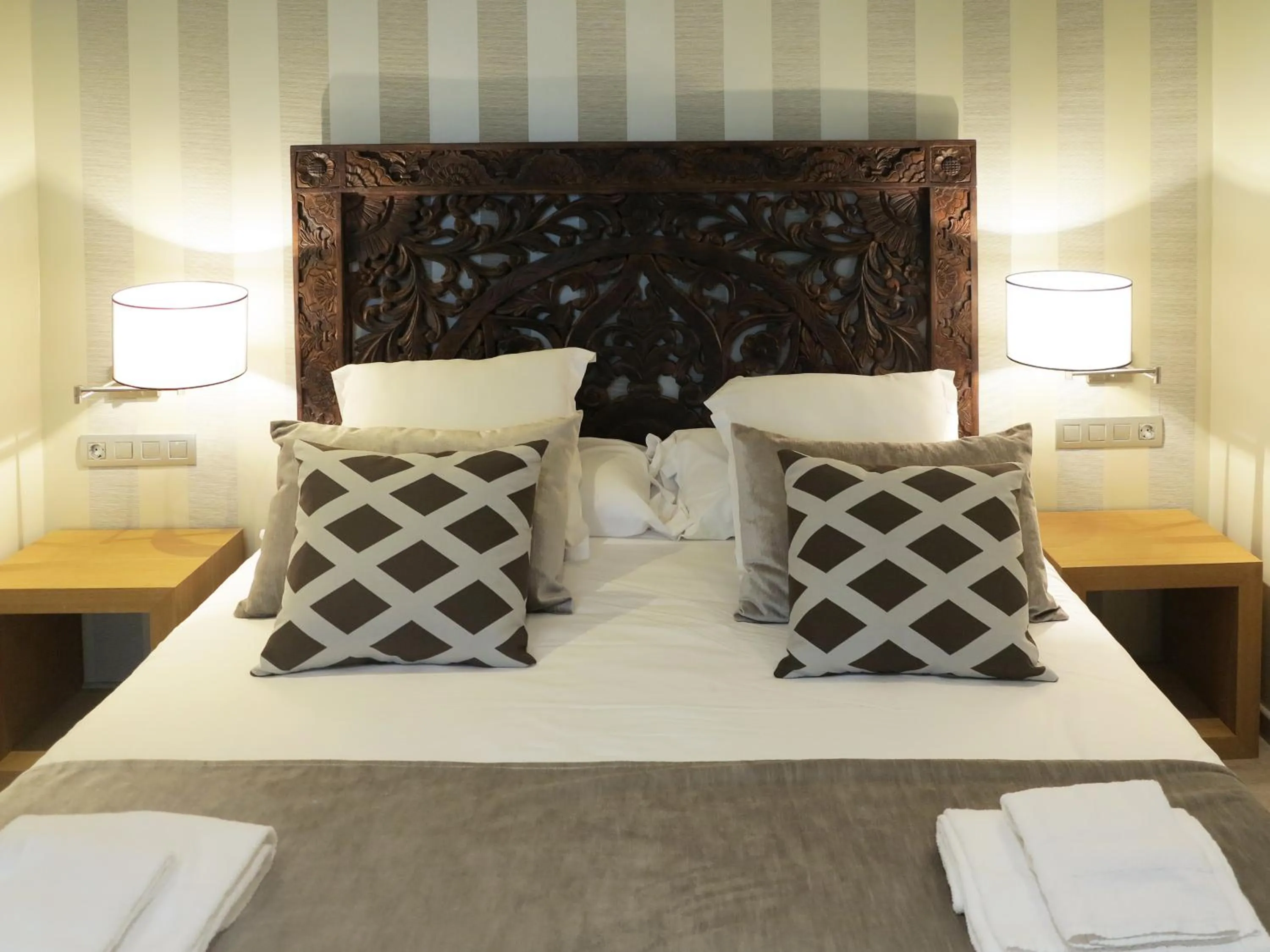 Bed in Serennia Exclusive Rooms