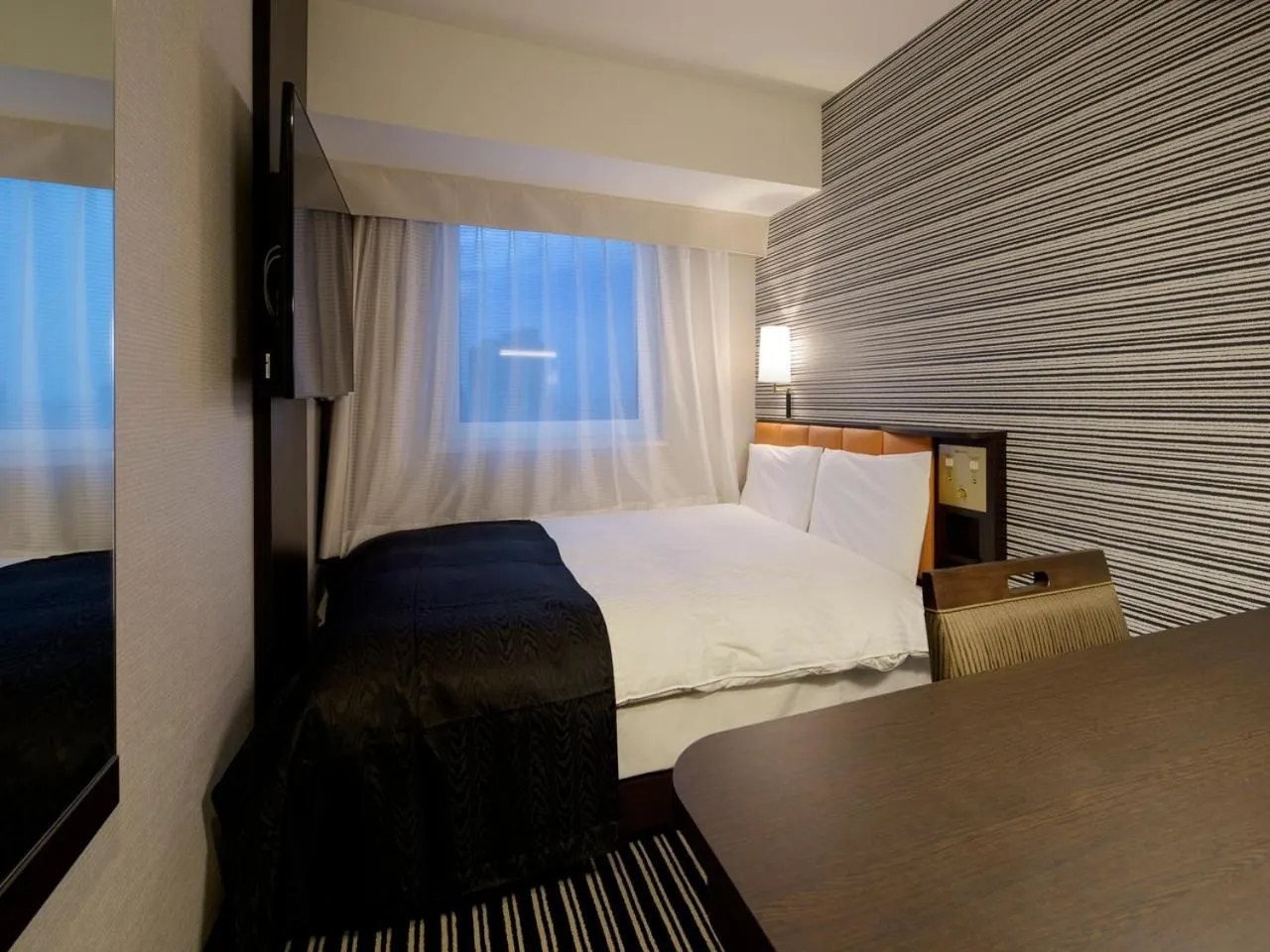 Photo of the whole room, Bed in APA Hotel Shinjuku Kabukicho Tower