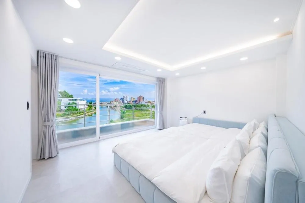 Bed in Gangneung The Gangmun Poolvilla and Spa Oceanview