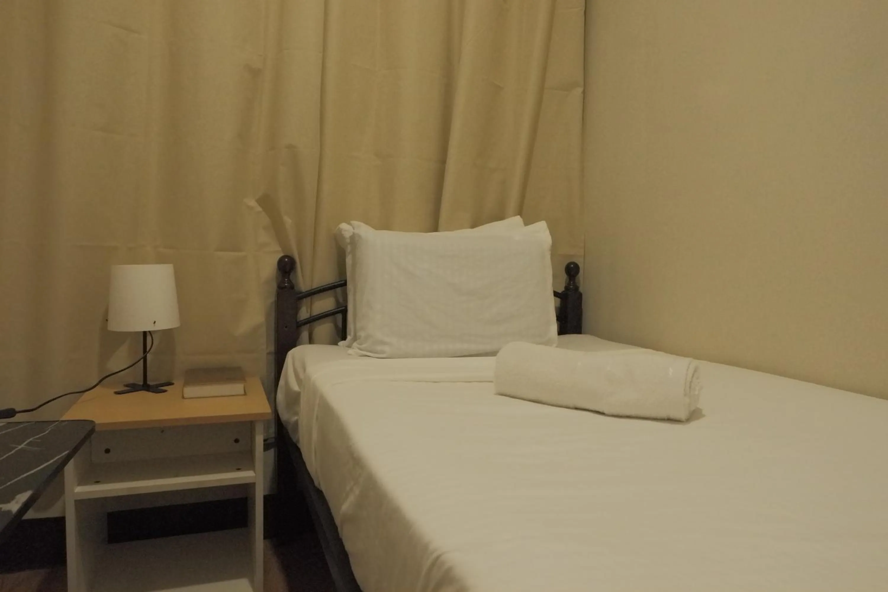 Bed in Brightwood Hotel & Residences