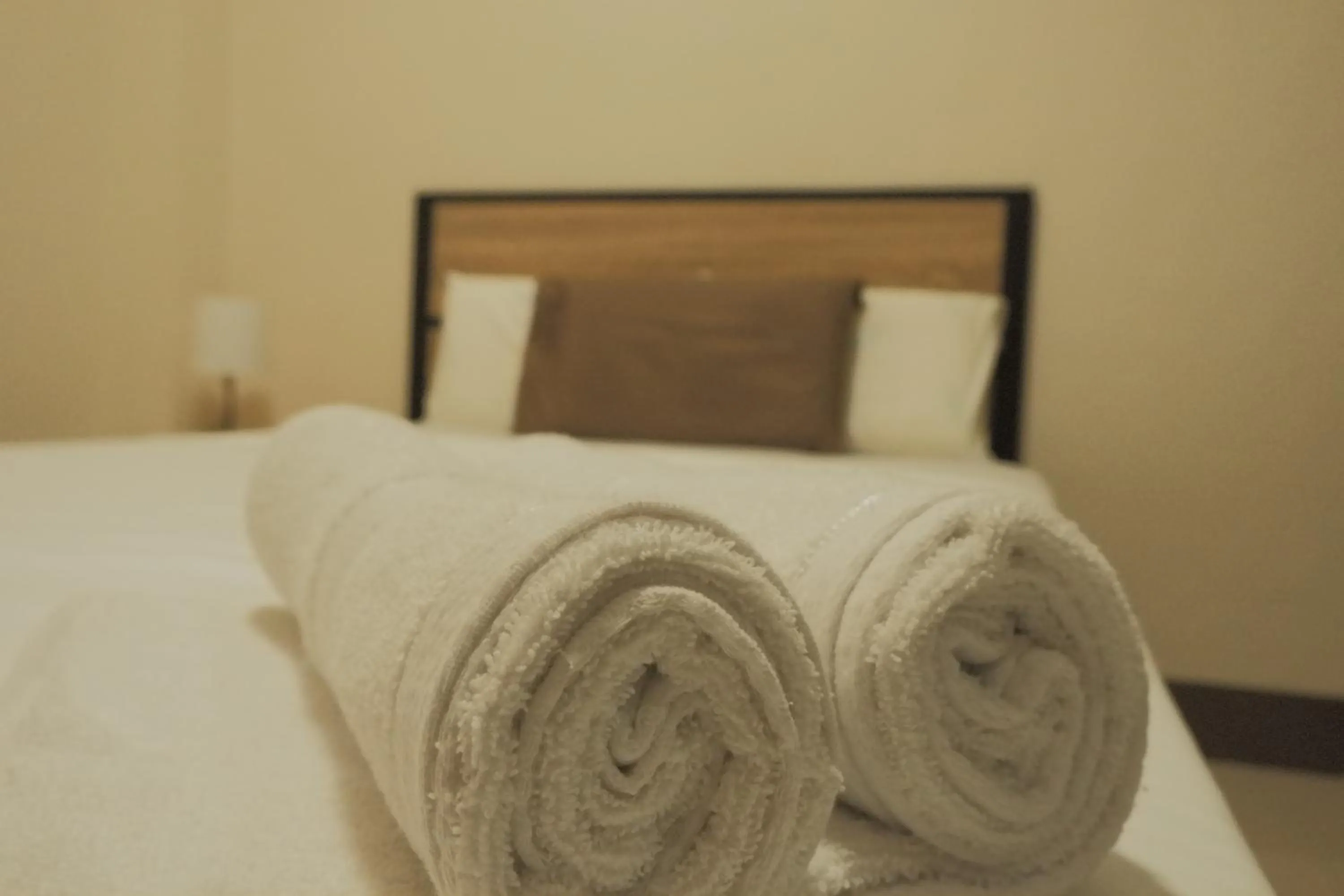 Bed in Brightwood Hotel & Residences