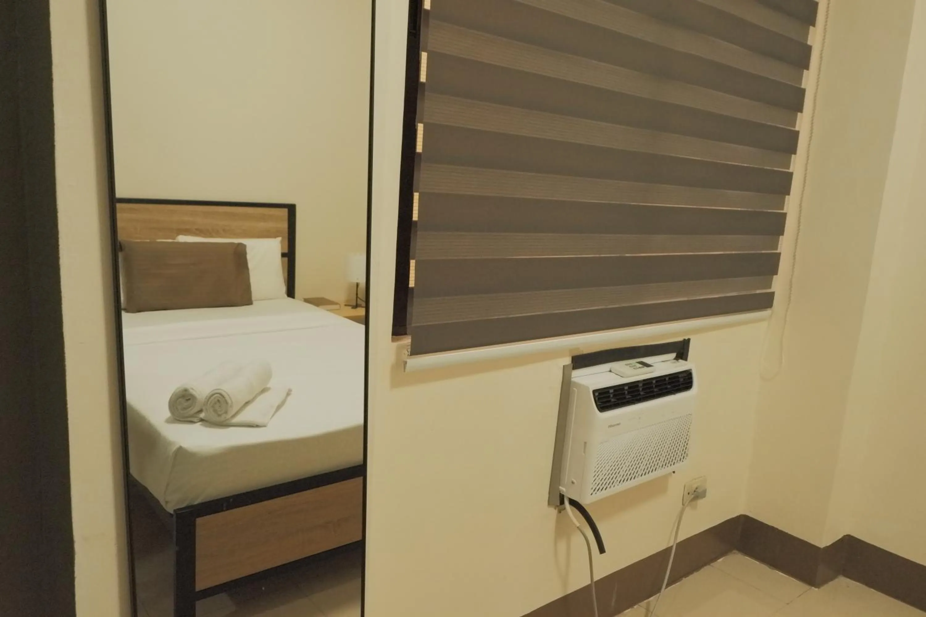 Bed in Brightwood Hotel & Residences