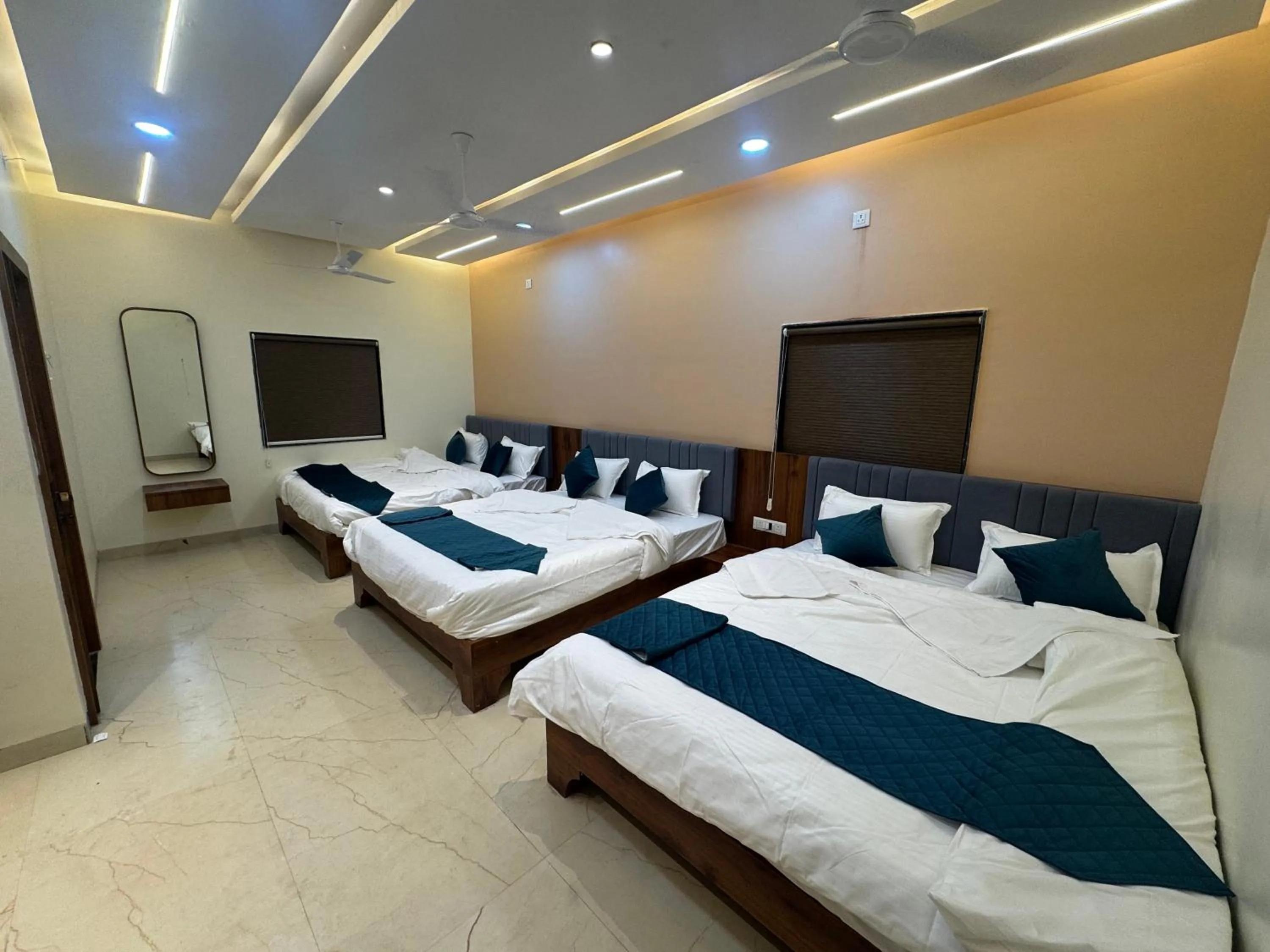 Bed in Hotel Tulsi inn