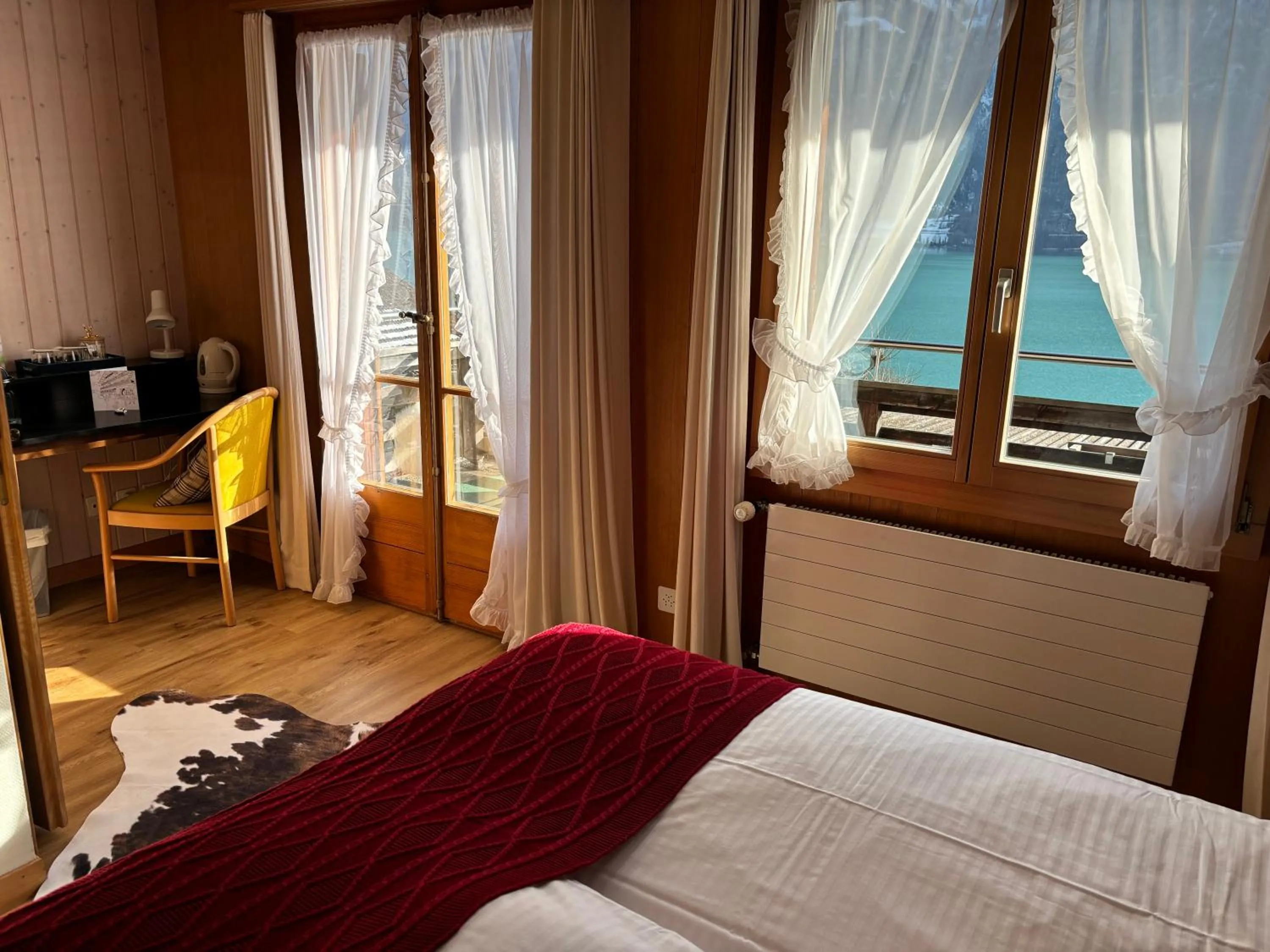 Photo of the whole room, Bed in Alpina Boutique Hotel Interlaken - Ringgenberg - Adults only !