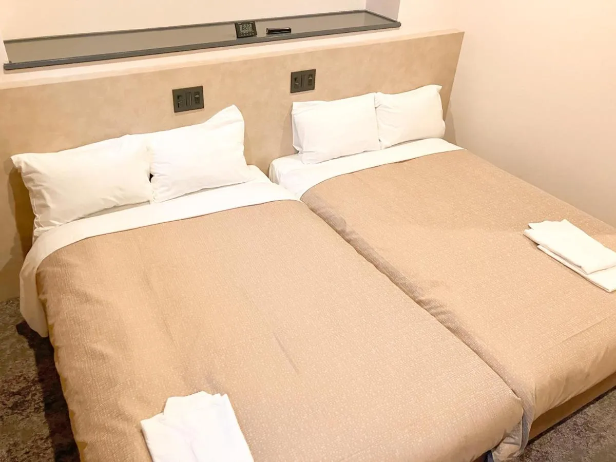 Bed in Hotel LiVEMAX Tendo